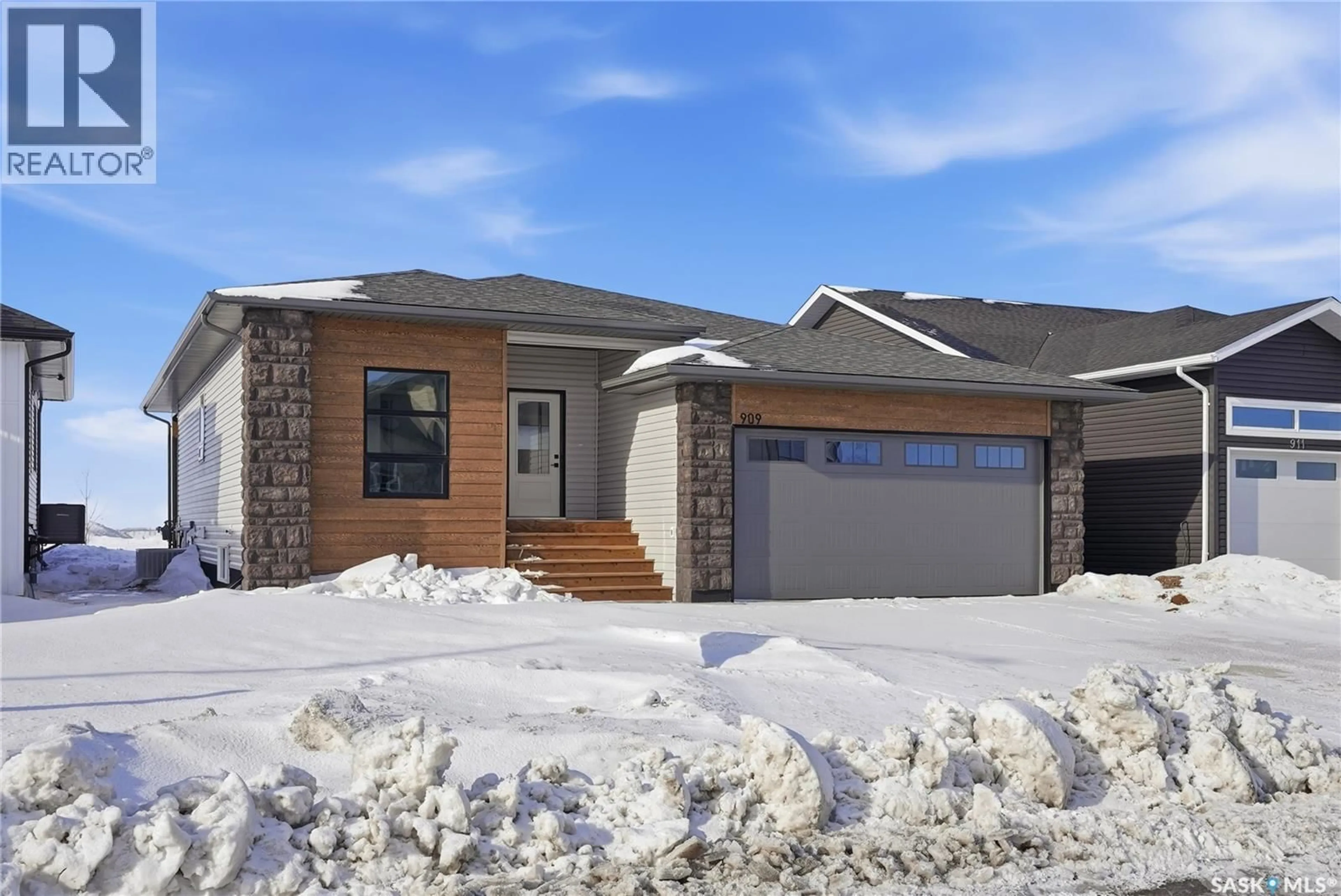 Home with brick exterior material, street for 909 ASPEN STREET, Humboldt Saskatchewan S0K2A0