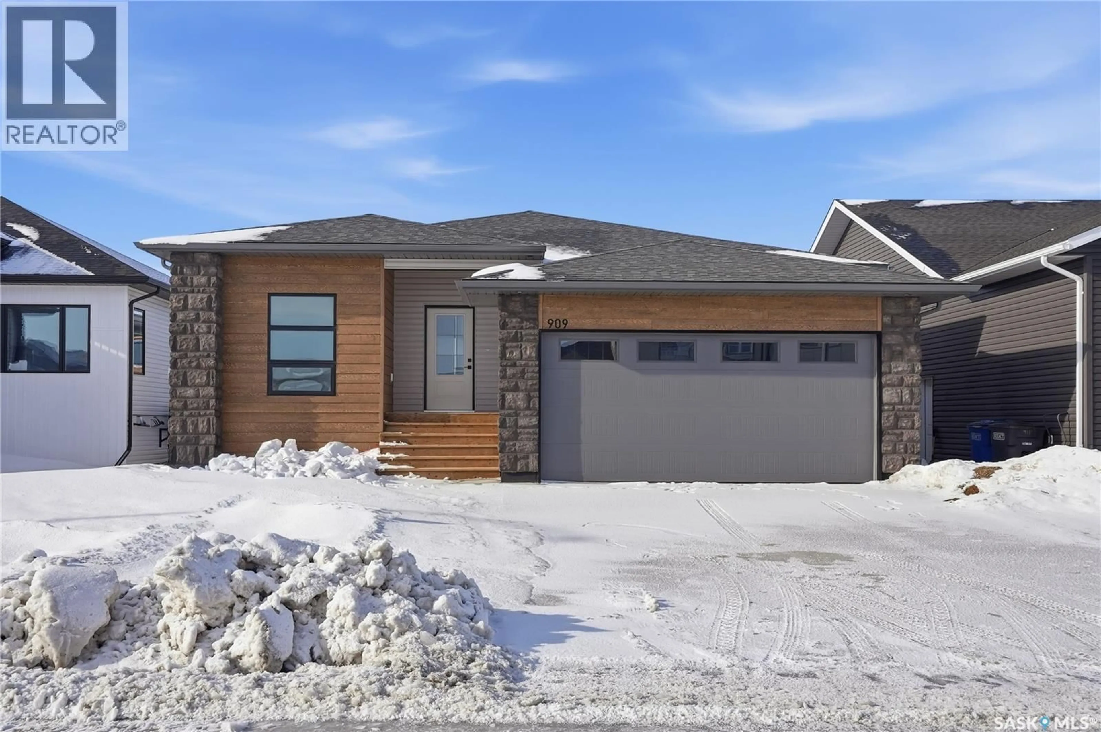 Home with brick exterior material, street for 909 ASPEN STREET, Humboldt Saskatchewan S0K2A0