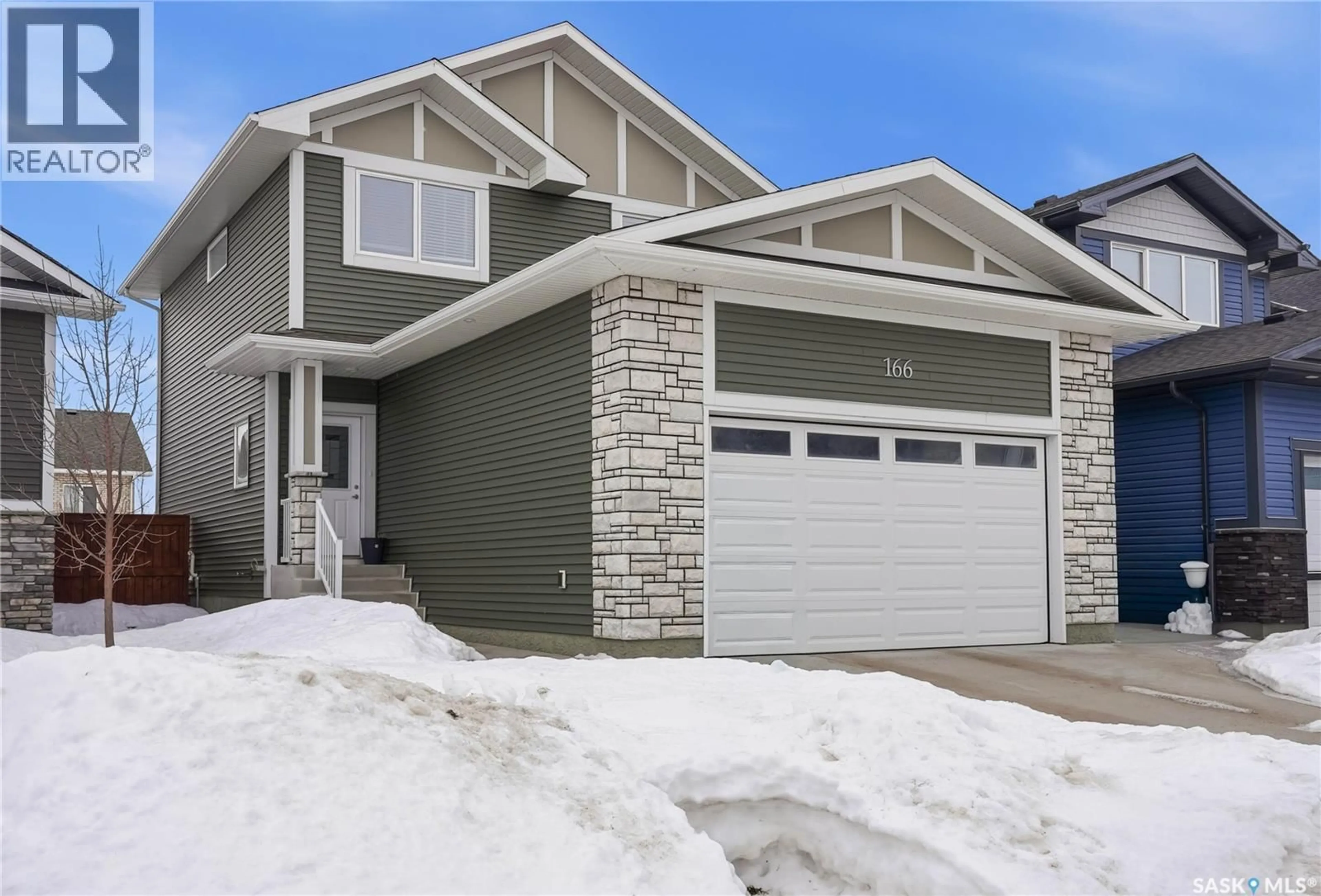 Home with vinyl exterior material, street for 166 BEAUDRY CRESCENT, Martensville Saskatchewan S0K2T1
