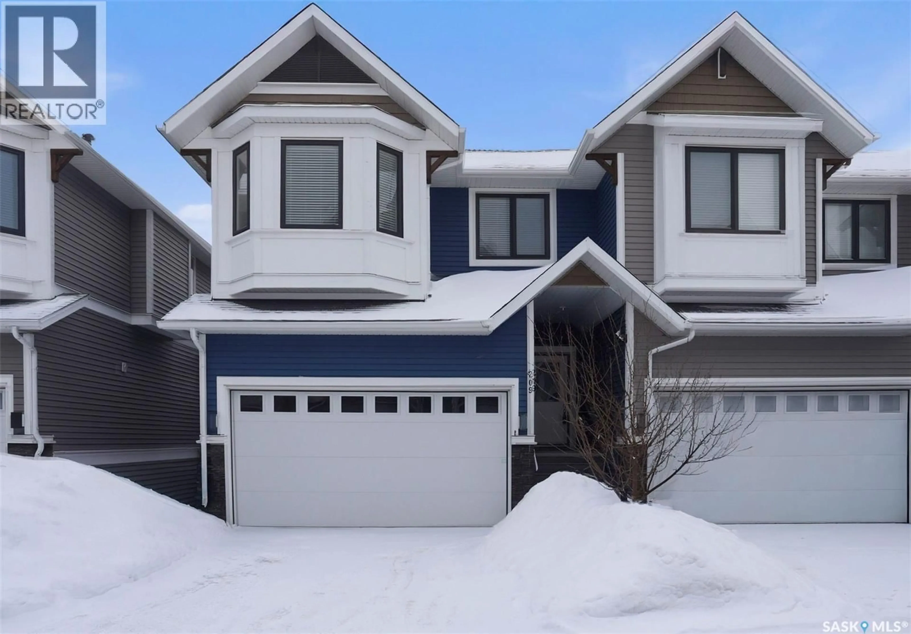 Home with vinyl exterior material, street for 209 - 3220 11TH STREET, Saskatoon Saskatchewan S7M5M4