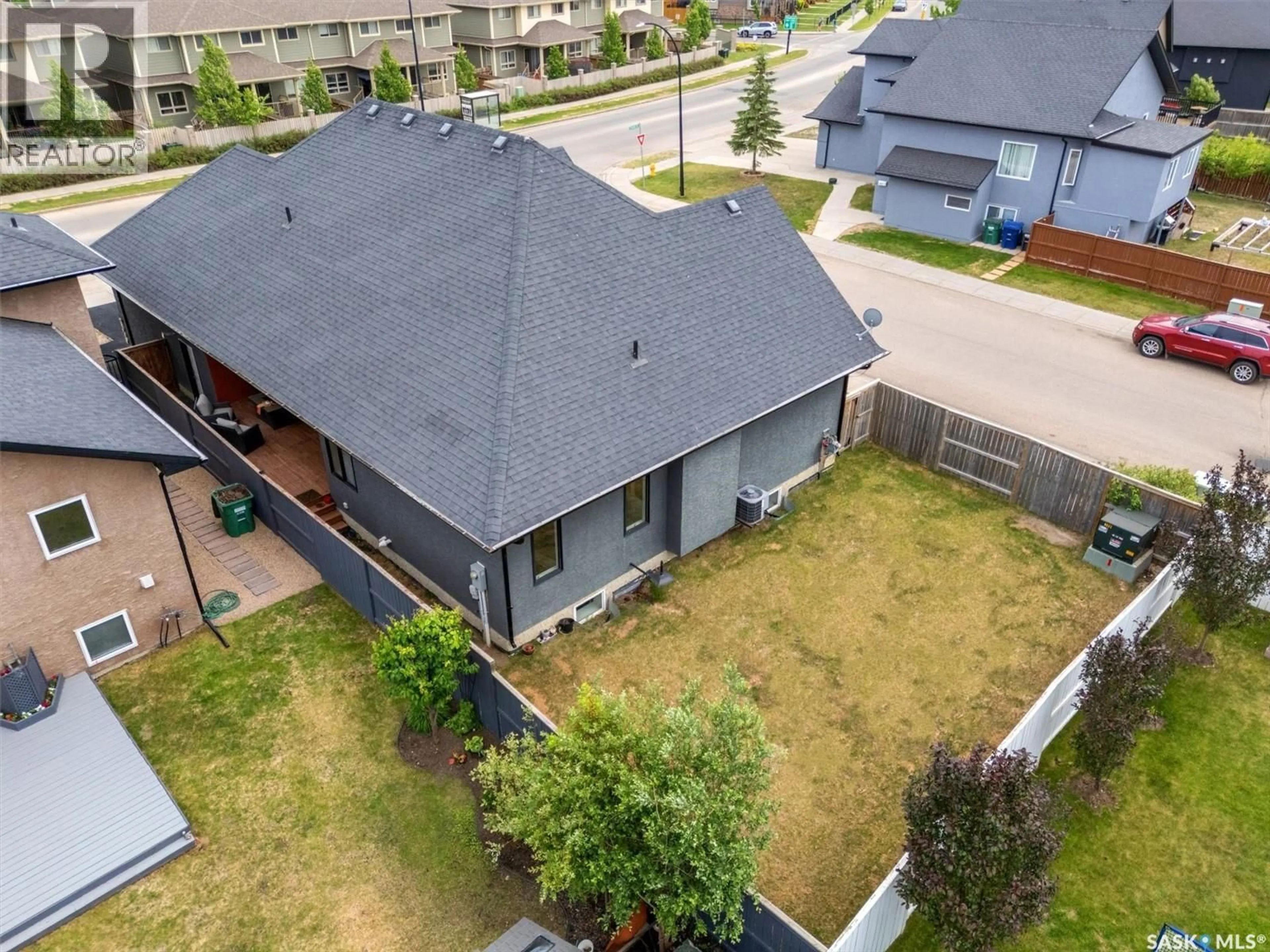 A pic from outside/outdoor area/front of a property/back of a property/a pic from drone, street for 1103 STENSRUD ROAD, Saskatoon Saskatchewan S7W0C9