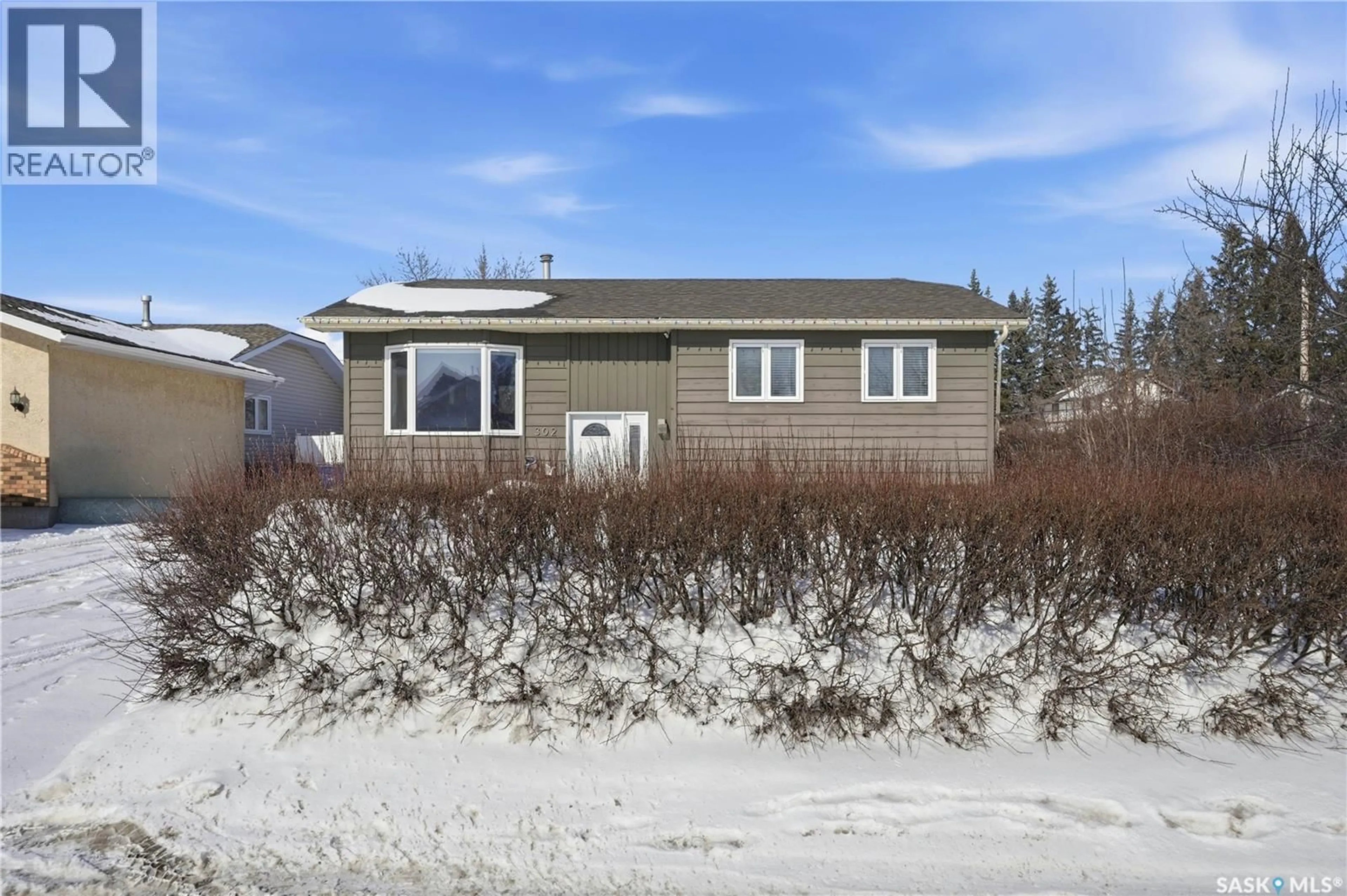 Home with vinyl exterior material, street for 302 ASSINIBOIA STREET, Balgonie Saskatchewan S0G0E0