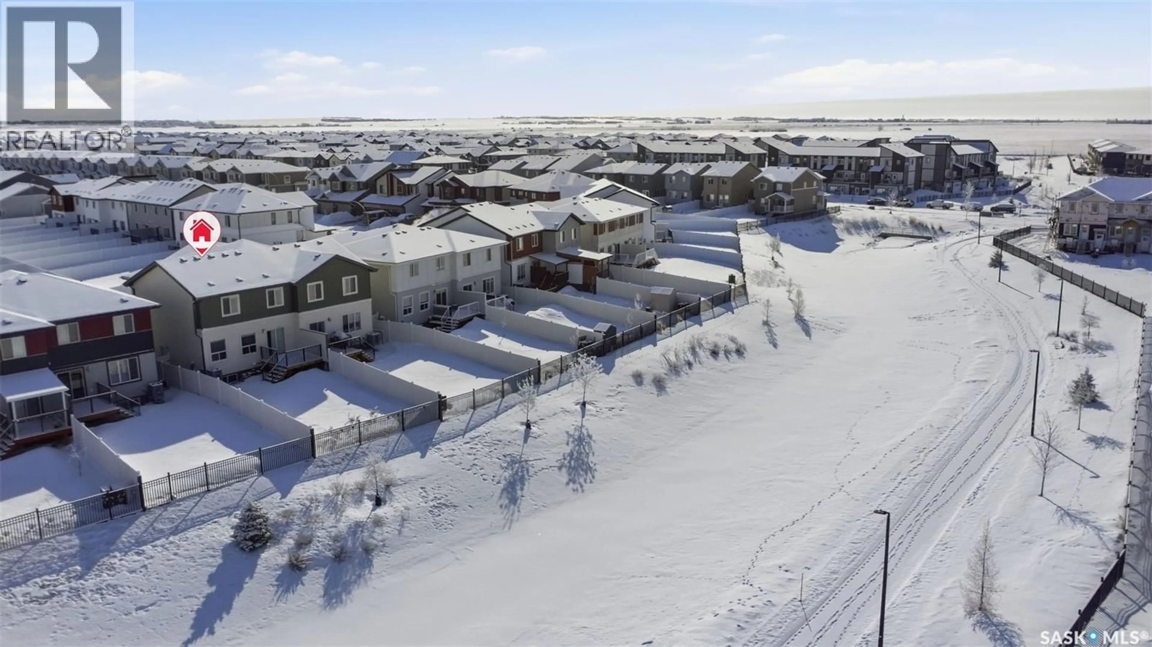 A pic from outside/outdoor area/front of a property/back of a property/a pic from drone, street for 410 MYLES HEIDT MANOR, Saskatoon Saskatchewan S7W1J1