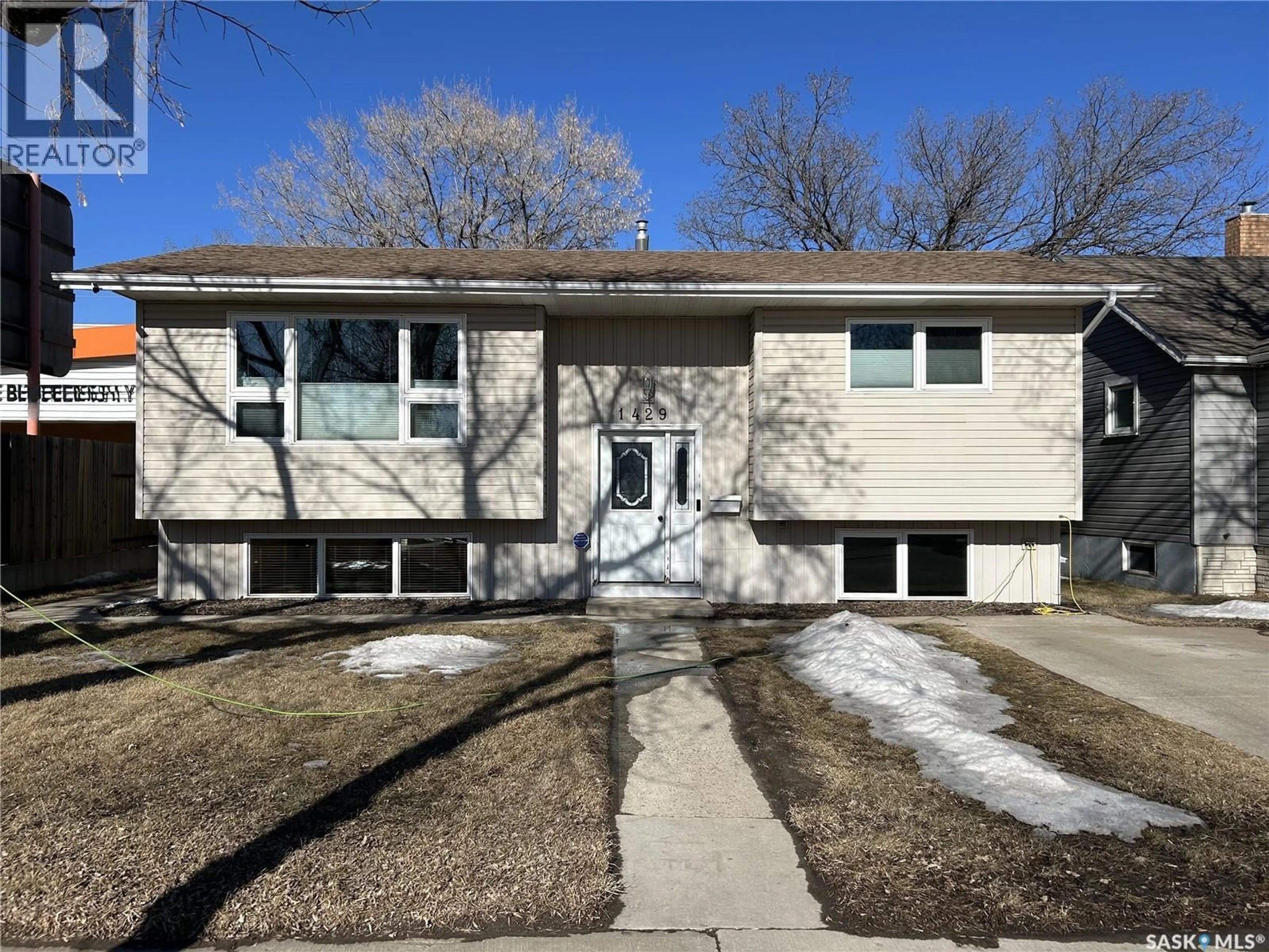 Home with vinyl exterior material, street for 1429 4TH STREET, Estevan Saskatchewan S4A0X3