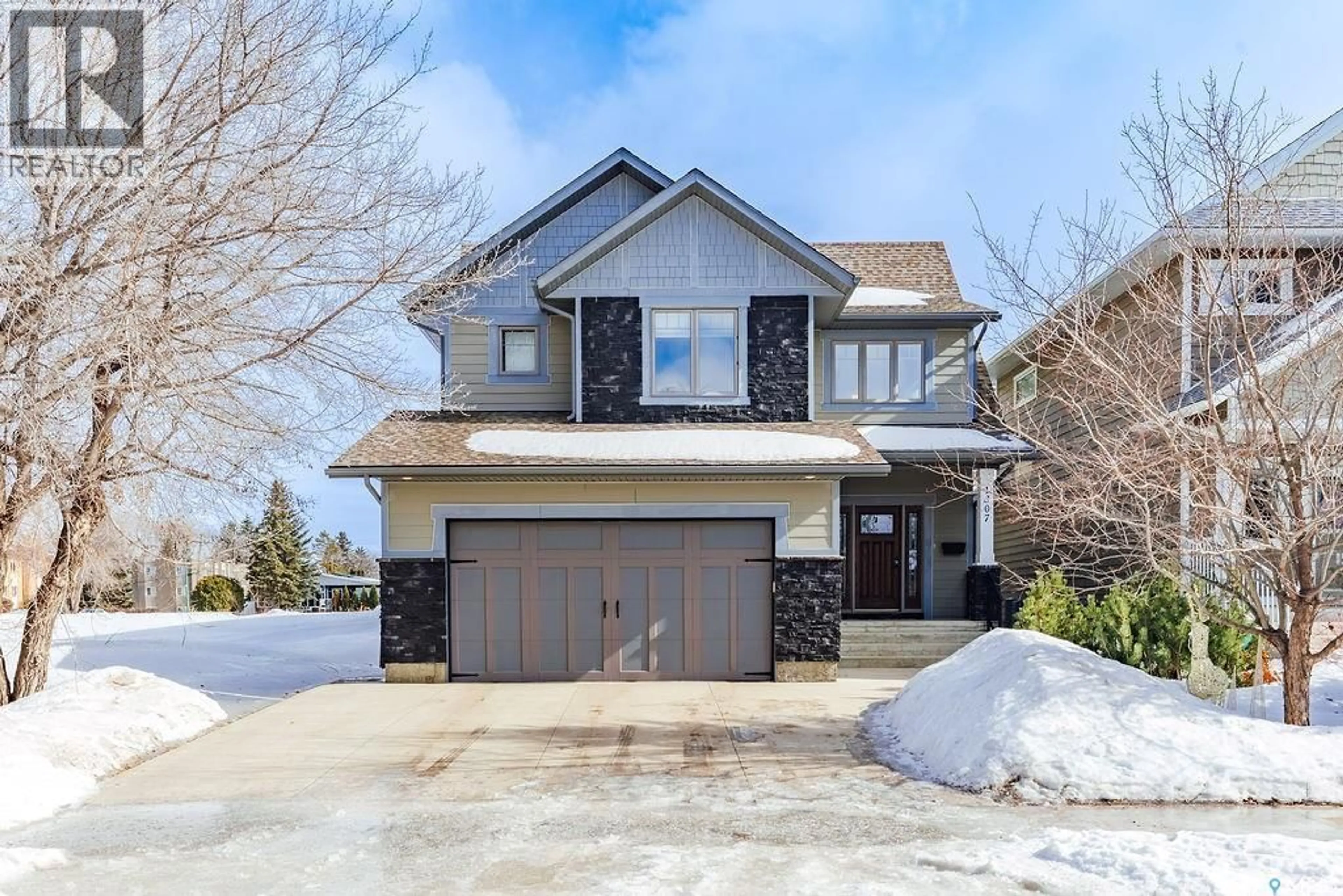 Home with brick exterior material, street for 1307 JACKSON AVENUE, Saskatoon Saskatchewan S7H2M9