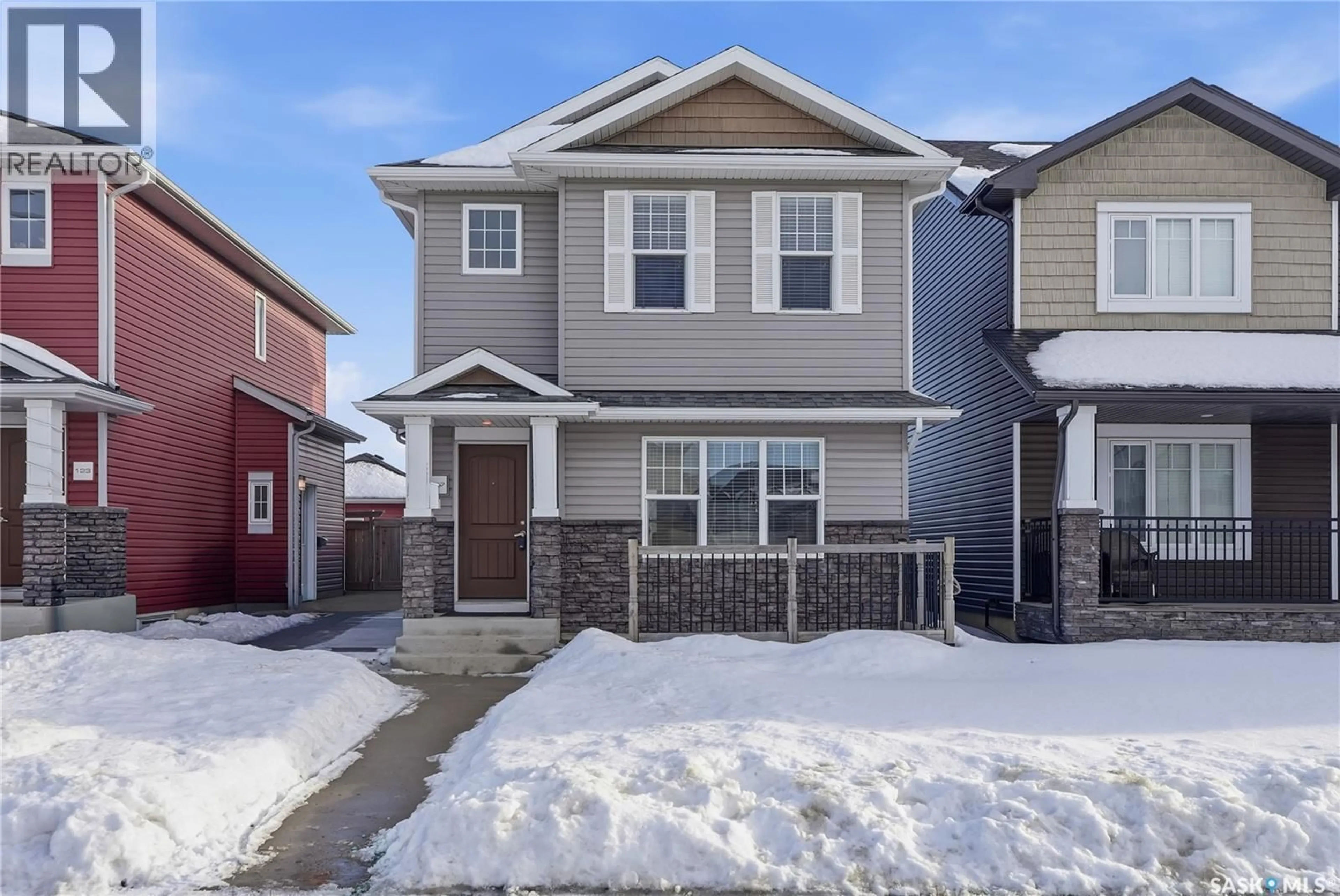 Home with vinyl exterior material, street for 127 TWEED LANE, Saskatoon Saskatchewan S7V0K1