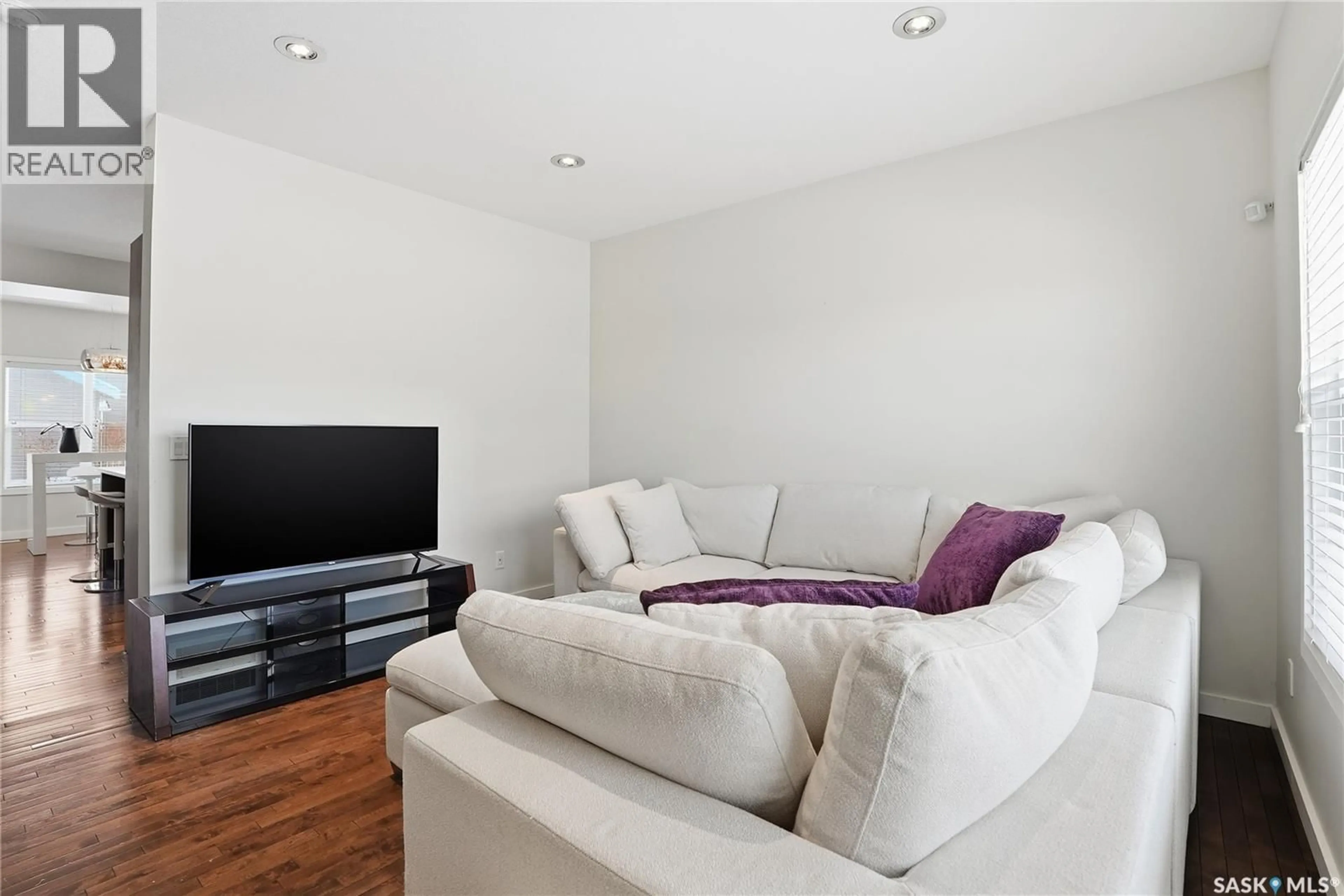 Living room with furniture, wood/laminate floor for 127 TWEED LANE, Saskatoon Saskatchewan S7V0K1