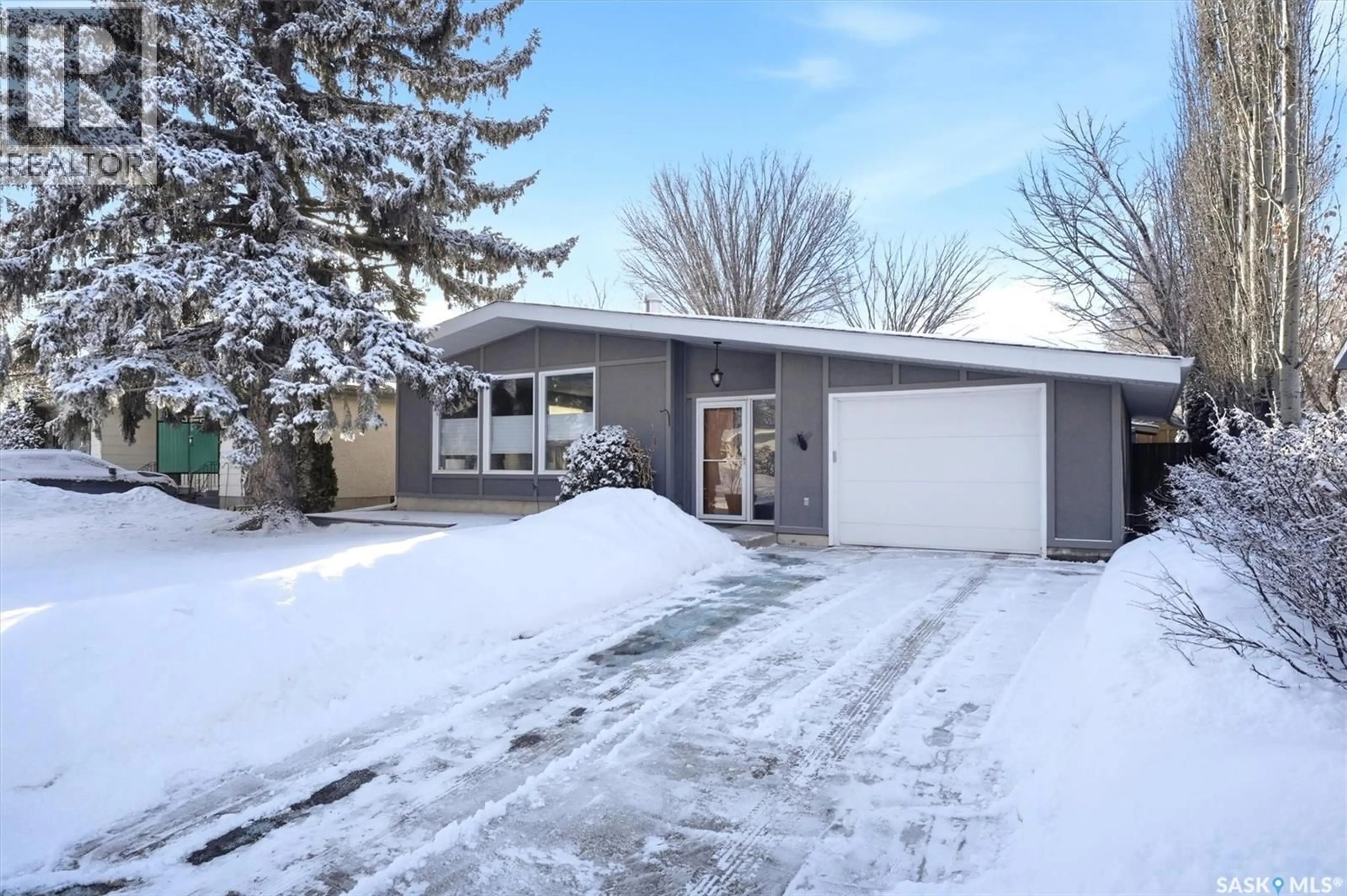 Home with vinyl exterior material, street for 2195 EASTHILL, Saskatoon Saskatchewan S7J3C8