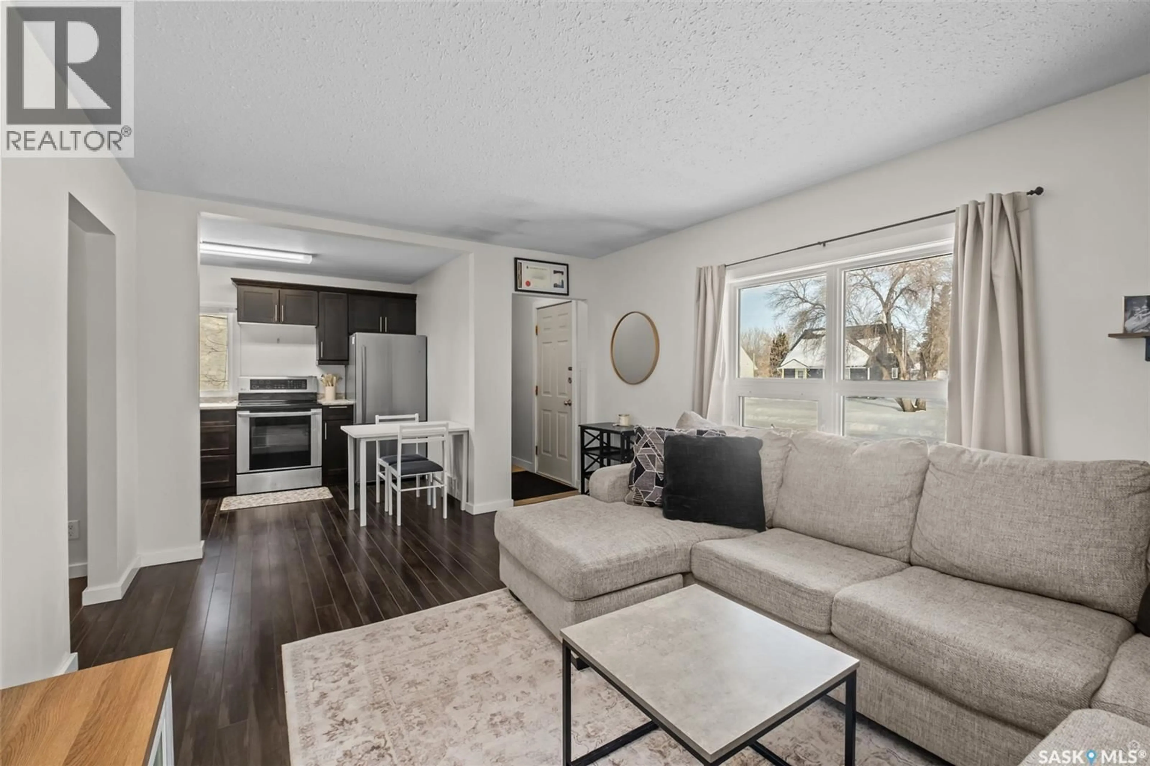 Living room with furniture, wood/laminate floor for 155 24TH STREET, Prince Albert Saskatchewan S6V1R6