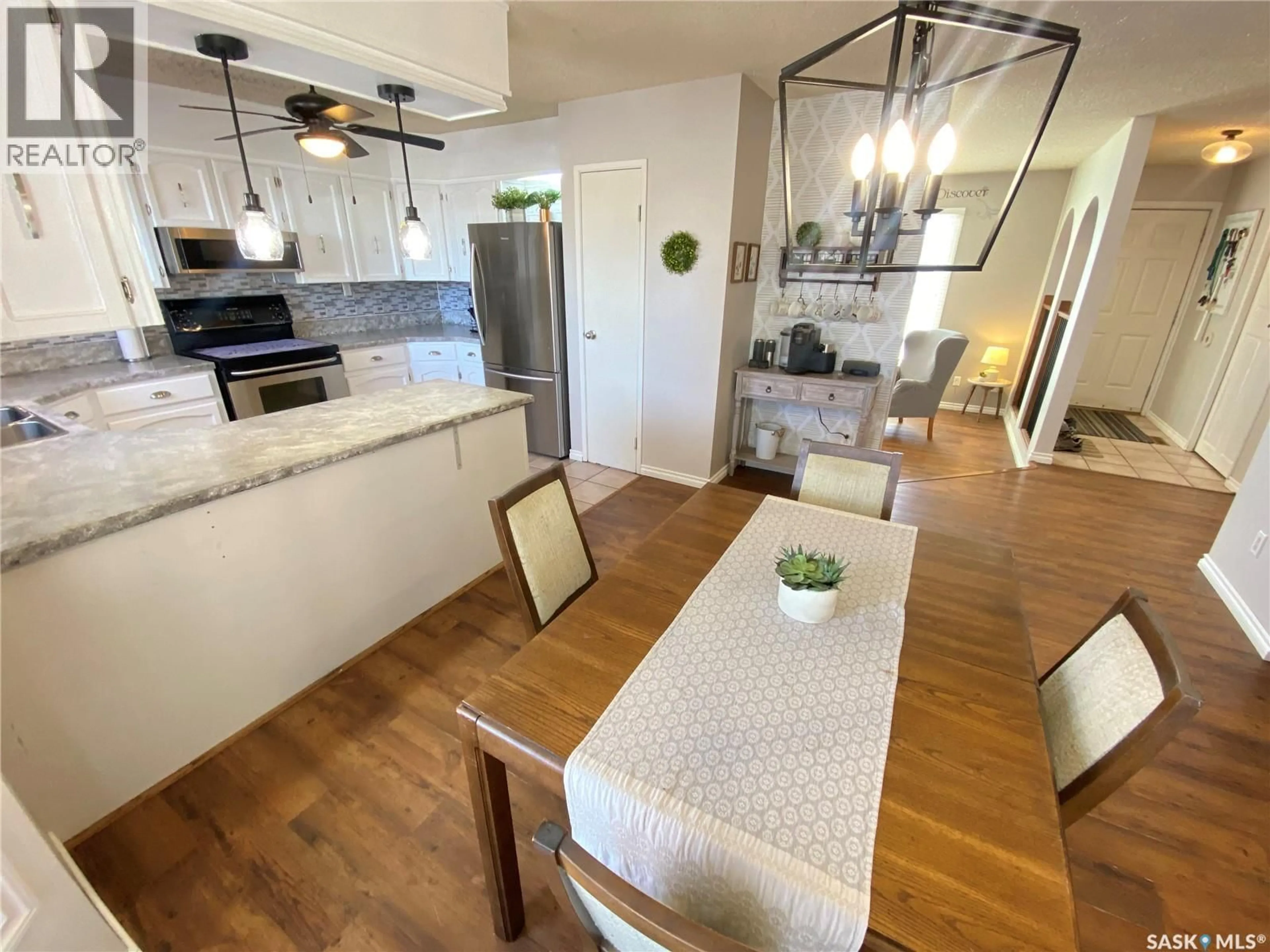 Open concept kitchen, wood/laminate floor for 70 MATHESON CRESCENT, Yorkton Saskatchewan S3N3M3