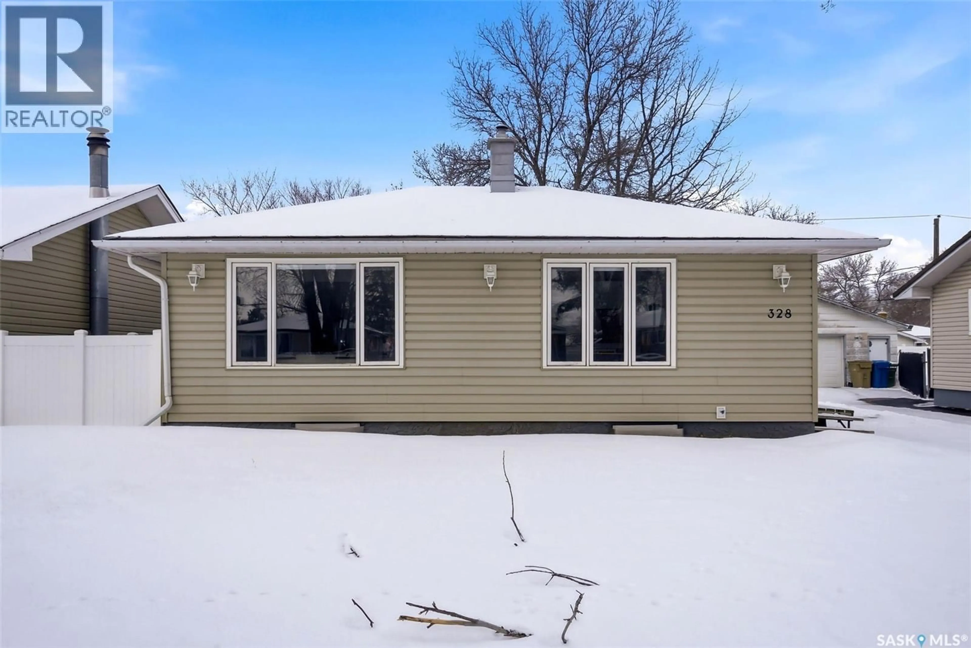 Home with vinyl exterior material, street for 328 TORONTO STREET, Regina Saskatchewan S4L0L5
