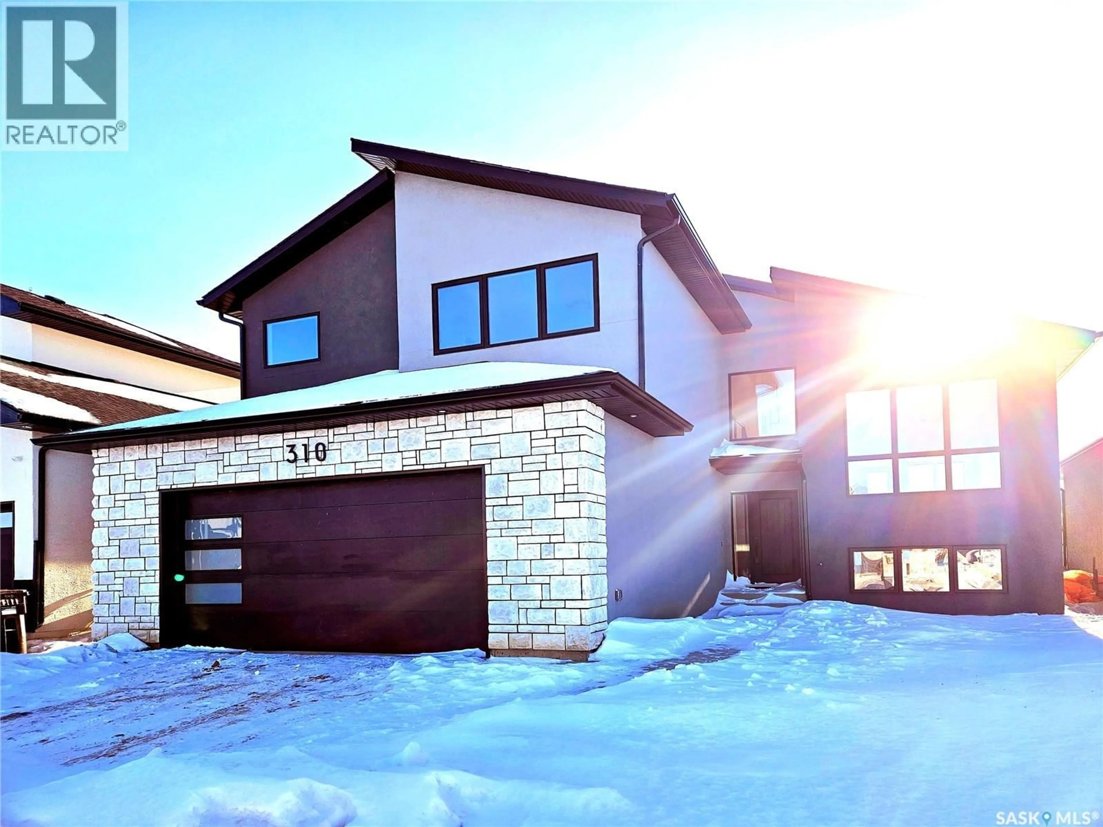 Home with brick exterior material, street for 310 FLYNN MANOR, Saskatoon Saskatchewan S7V0Z4