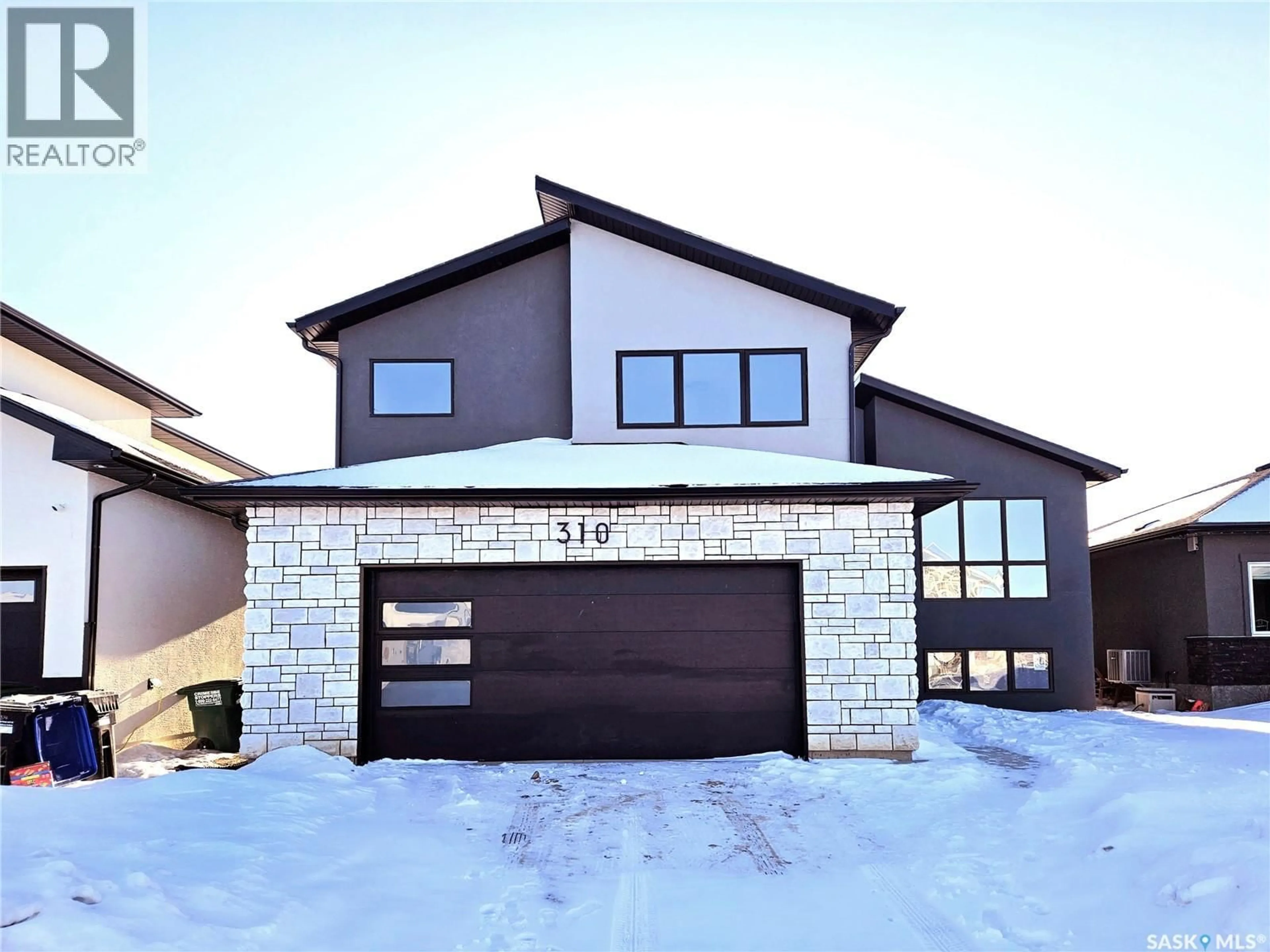 Home with brick exterior material, street for 310 FLYNN MANOR, Saskatoon Saskatchewan S7V0Z4