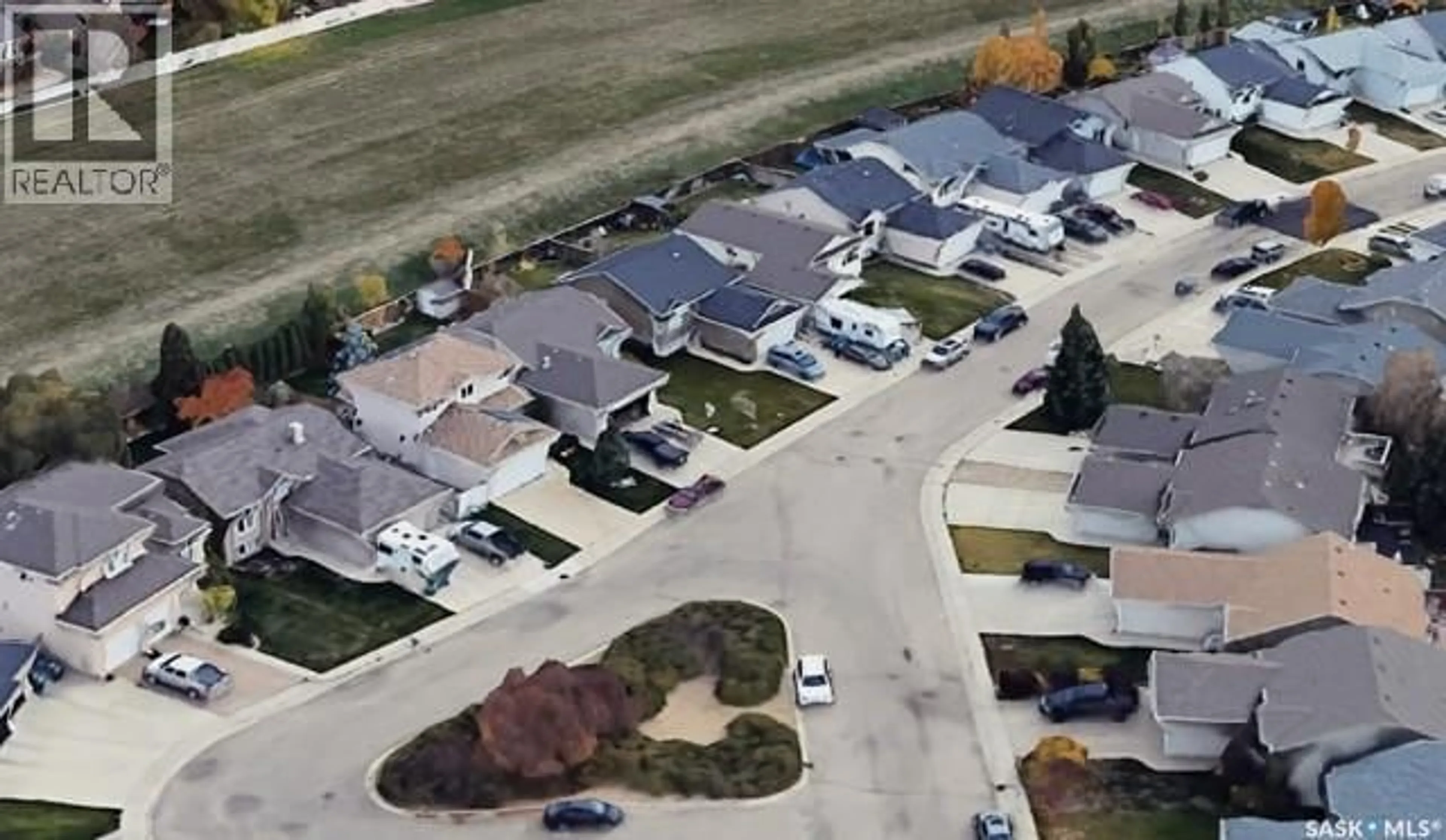 A pic from outside/outdoor area/front of a property/back of a property/a pic from drone, street for 227 OVERHOLT PLACE, Saskatoon Saskatchewan S7N4S9