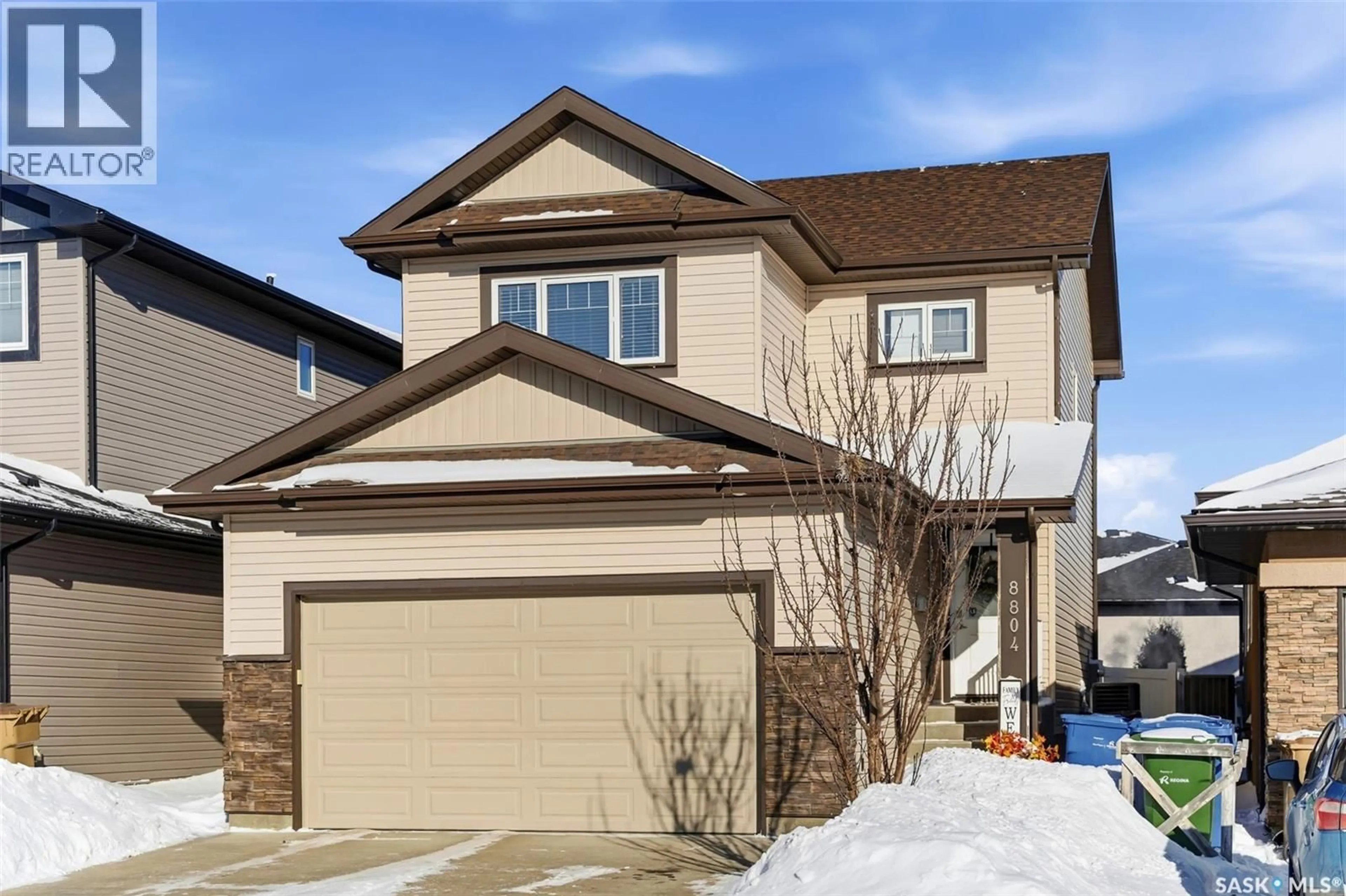 Home with vinyl exterior material, street for 8804 KESTRAL DRIVE, Regina Saskatchewan S4Y0C2
