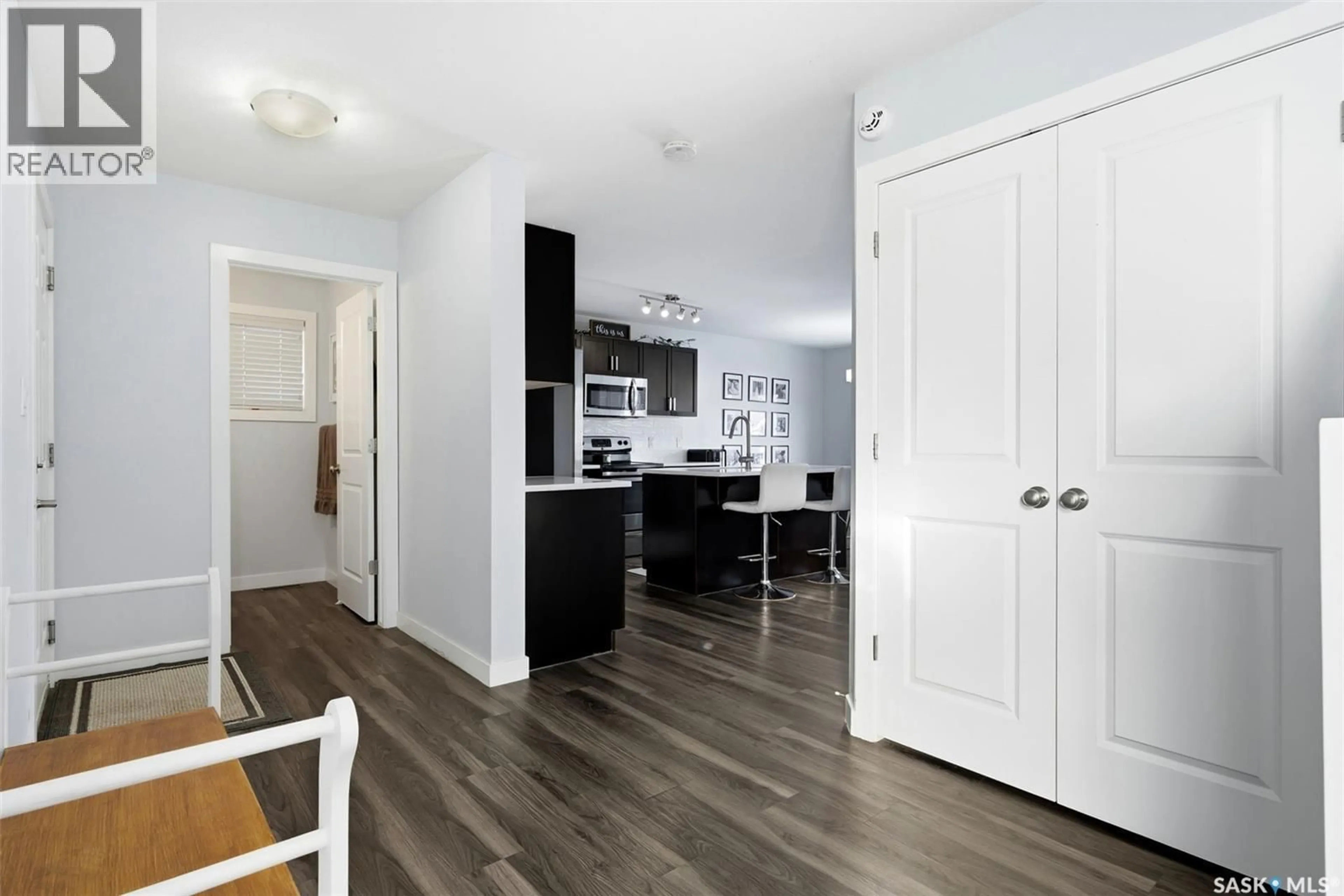 Open concept kitchen, wood/laminate floor for 8804 KESTRAL DRIVE, Regina Saskatchewan S4Y0C2