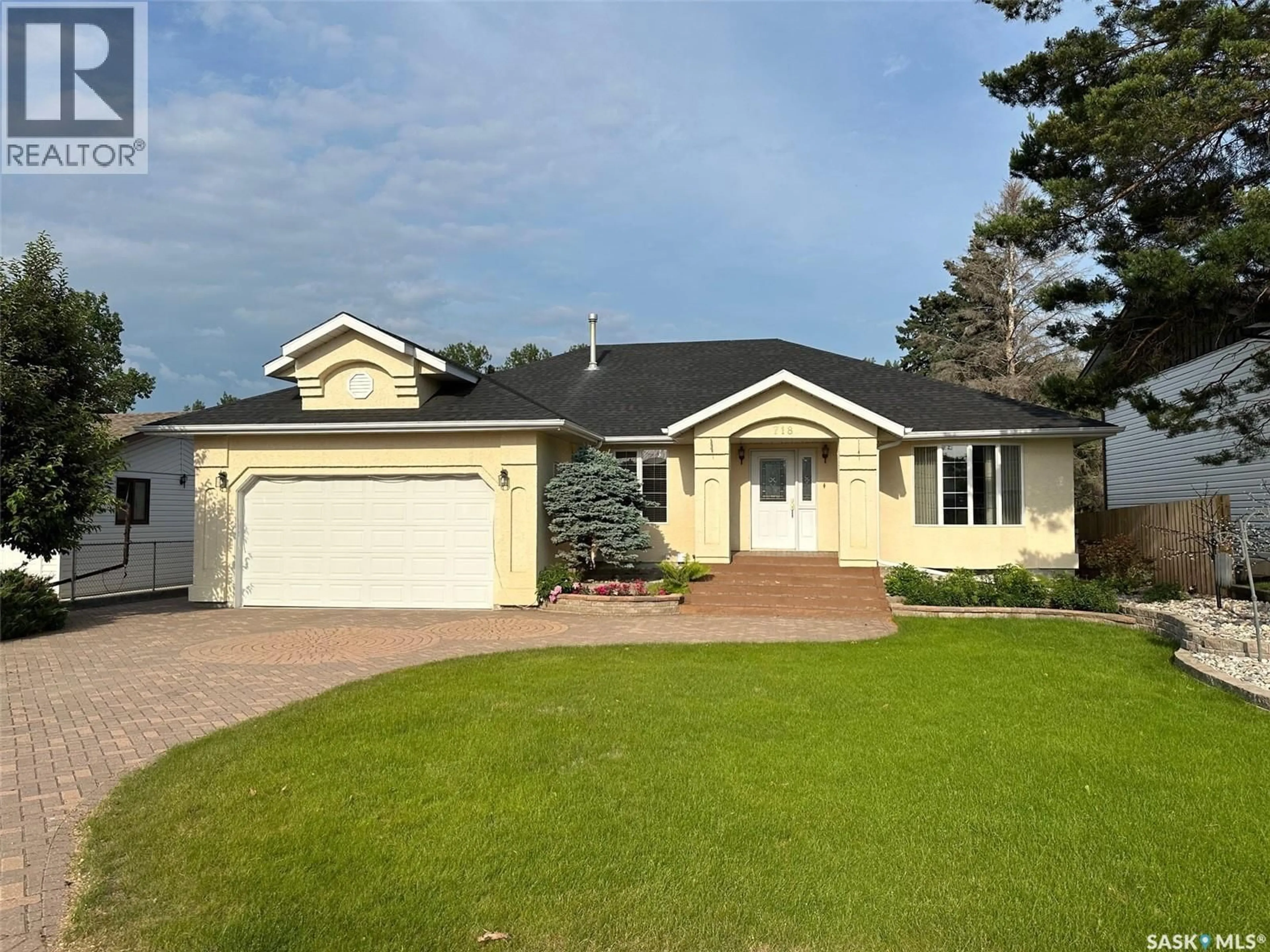 Home with vinyl exterior material, street for 718 DONALD STREET, Hudson Bay Saskatchewan S0E0Y0