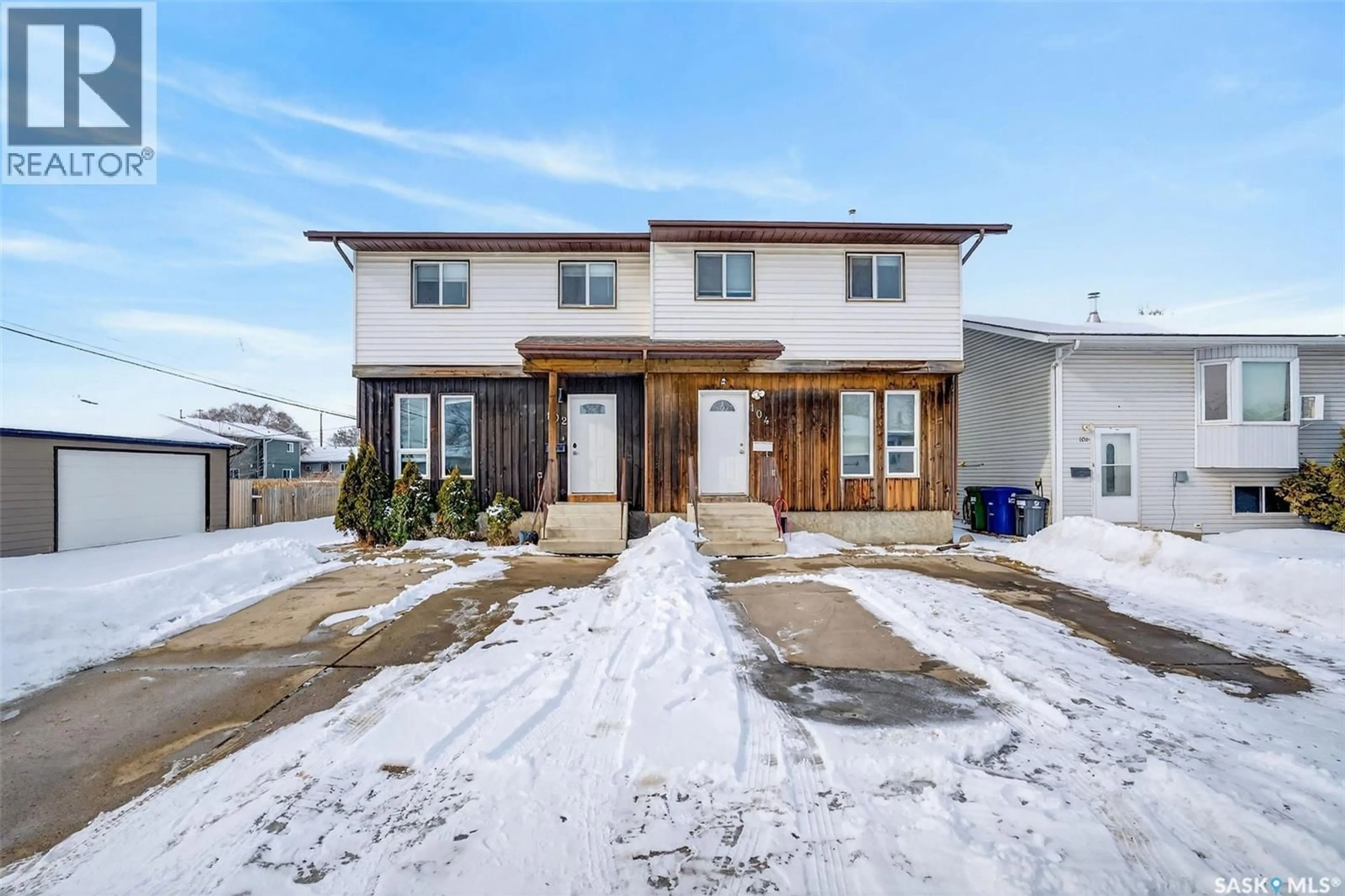 Home with brick exterior material, street for 102-104 HEDLEY STREET, Saskatoon Saskatchewan S7N4G4