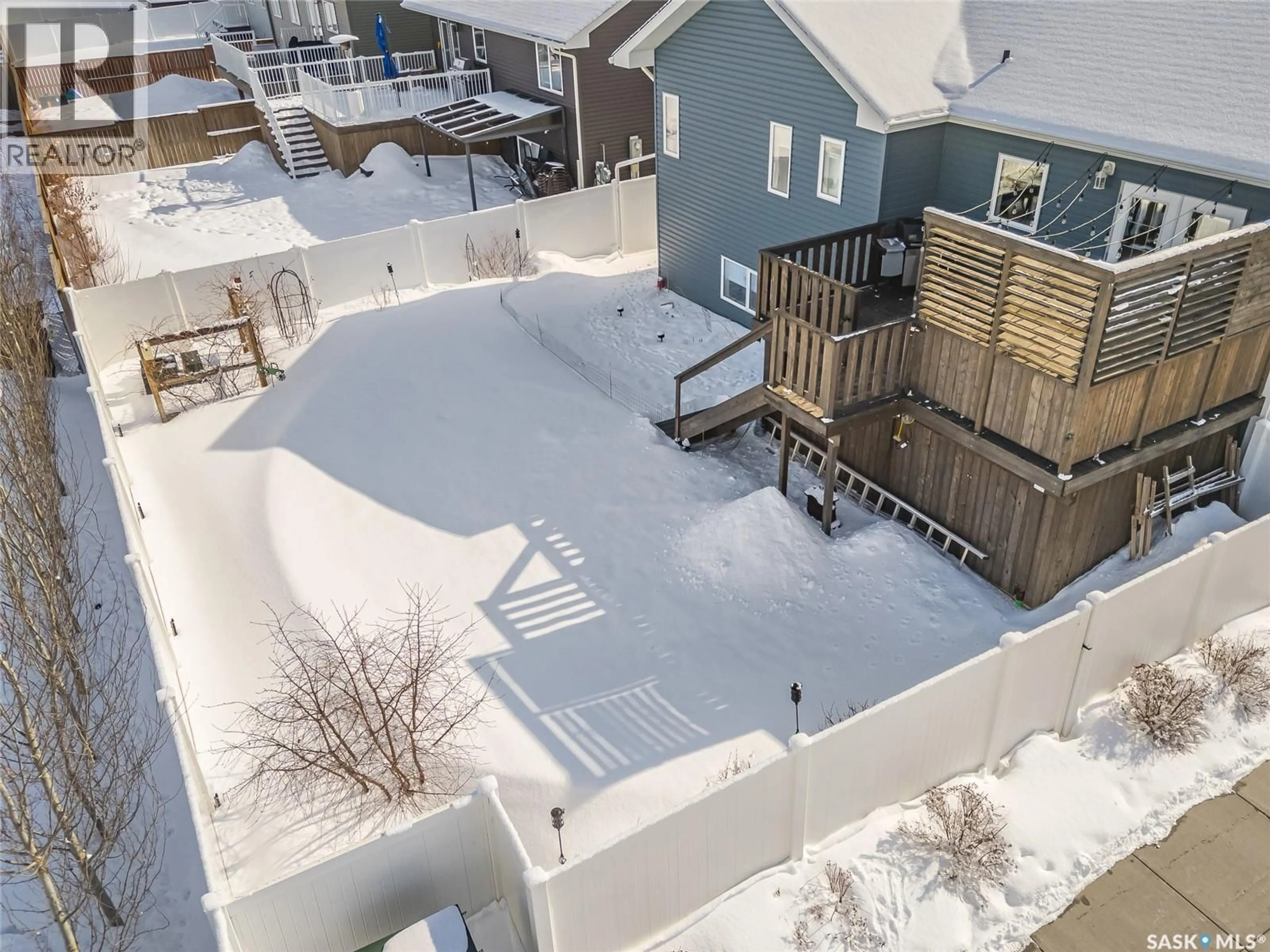 A pic from outside/outdoor area/front of a property/back of a property/a pic from drone, city buildings view from balcony for 201 COWAN CRESCENT, Martensville Saskatchewan S0K2T1
