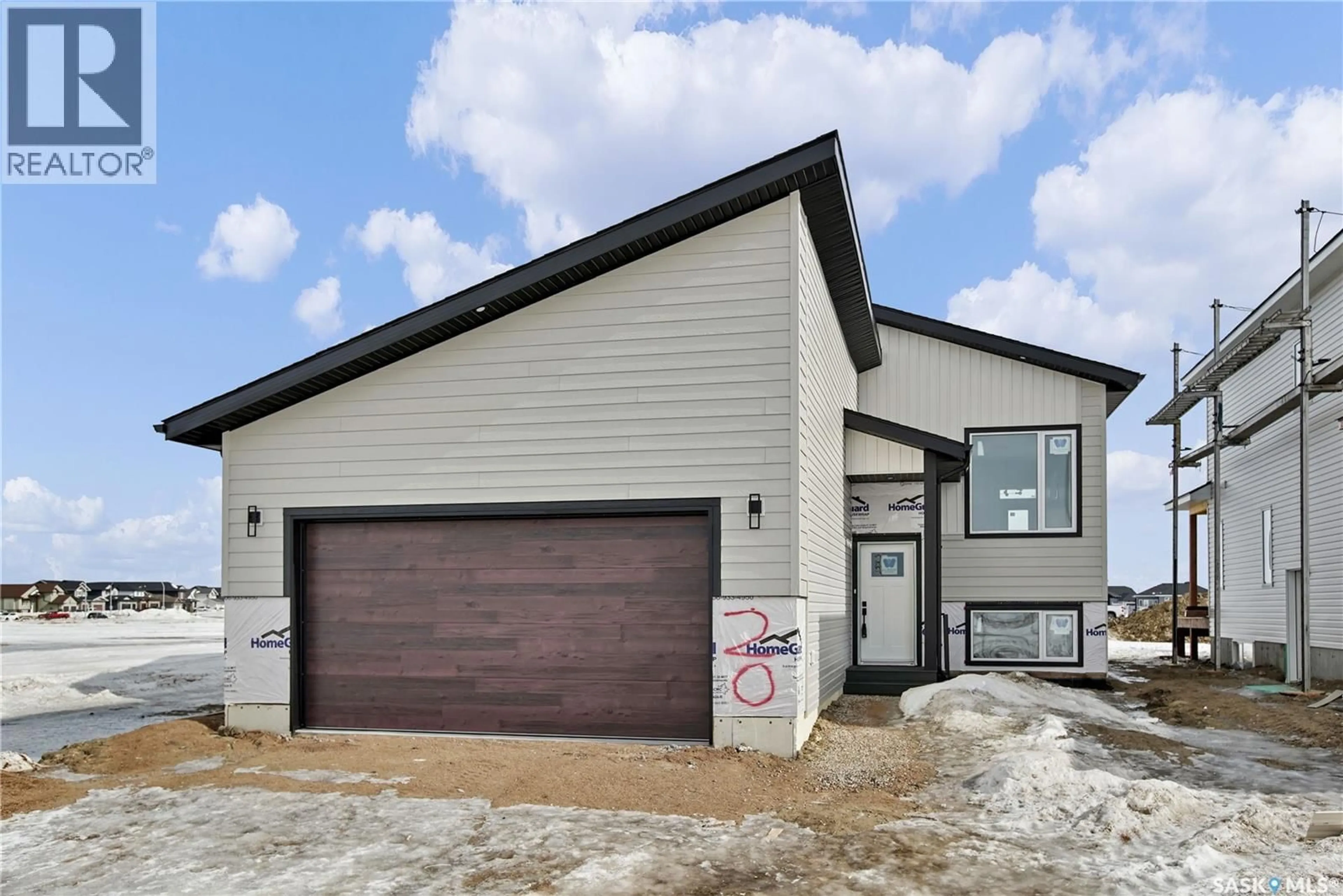 Home with vinyl exterior material, street for 220 VETERANS DRIVE, Warman Saskatchewan S0K4S3