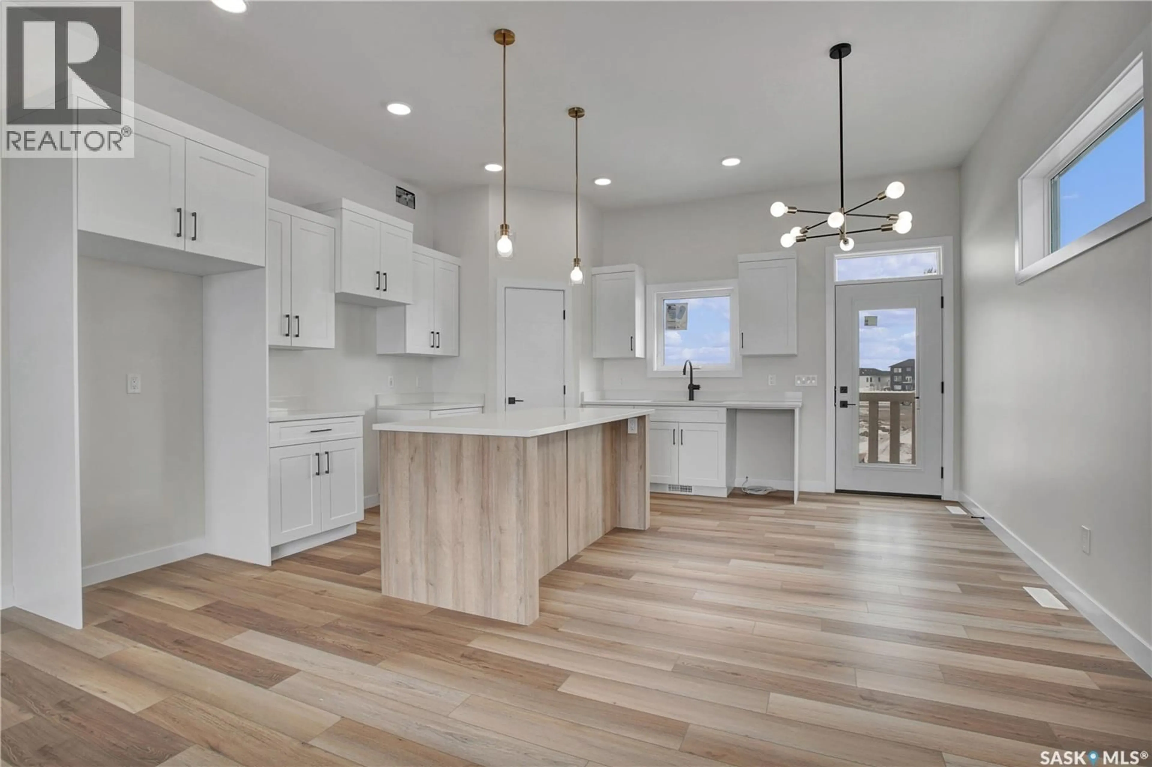 Open concept kitchen, wood/laminate floor for 220 VETERANS DRIVE, Warman Saskatchewan S0K4S3