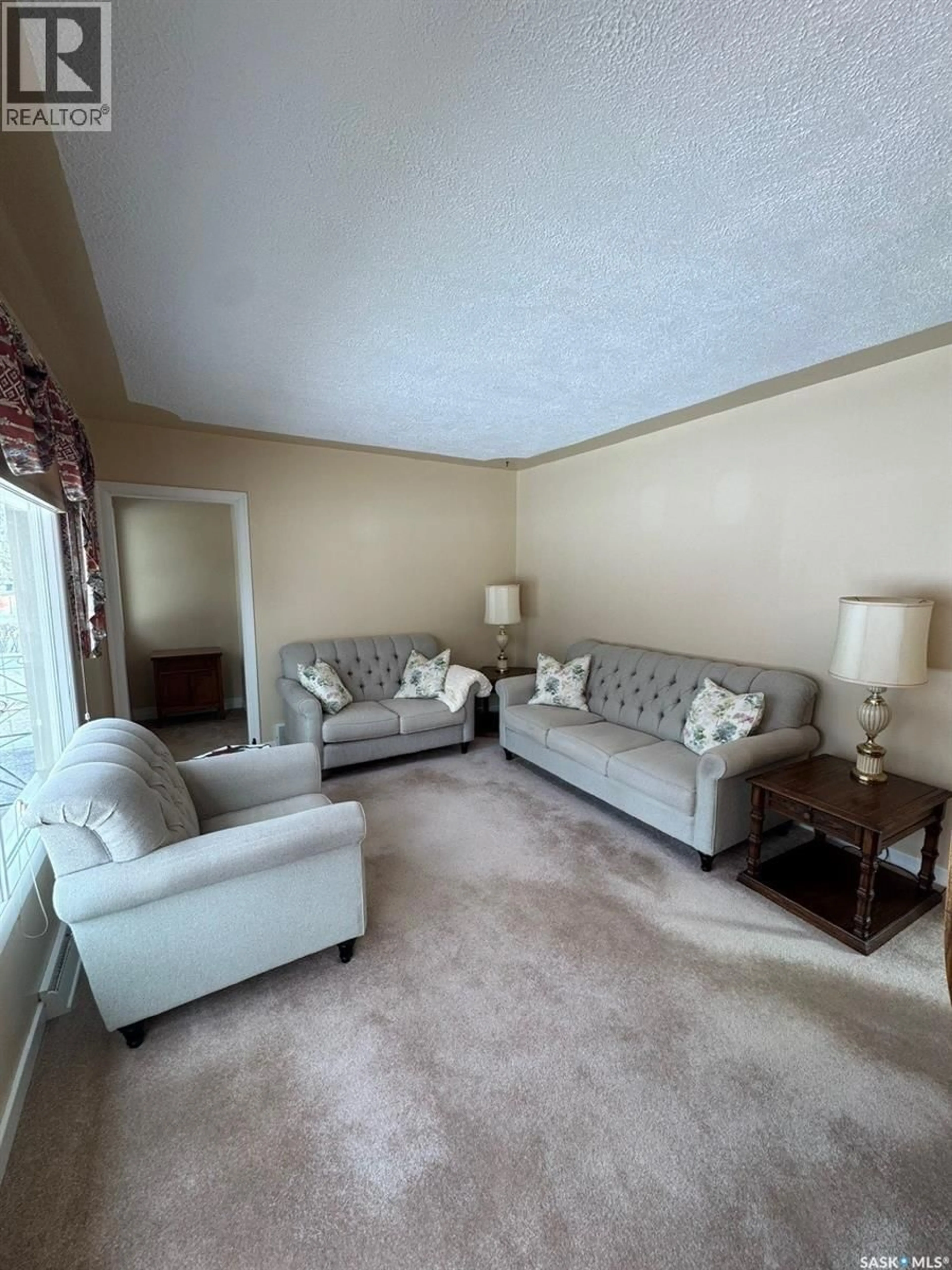 Living room with furniture, carpet floor for 1082 113TH STREET, North Battleford Saskatchewan S9A2M1