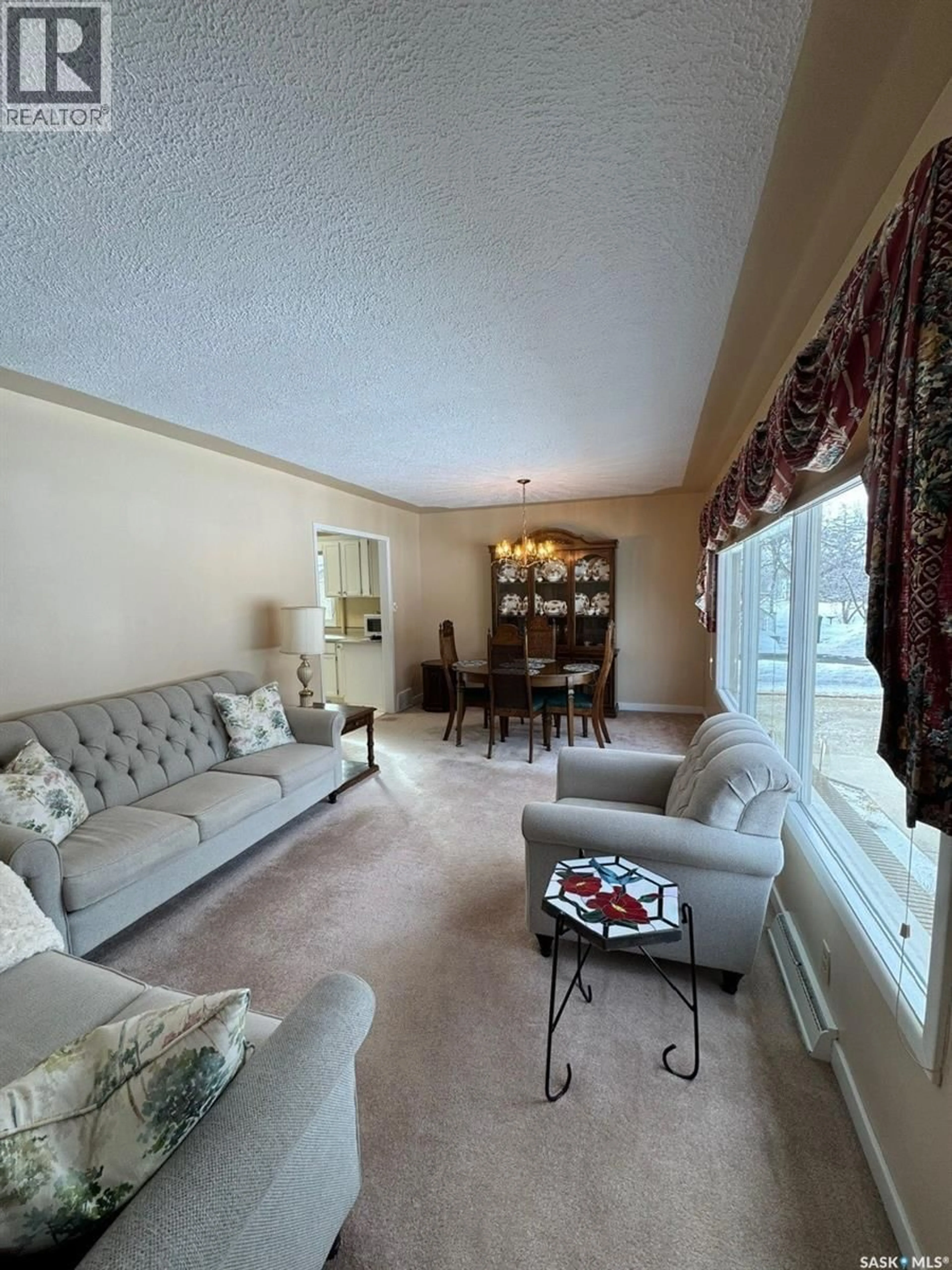 Living room with furniture, carpet floor for 1082 113TH STREET, North Battleford Saskatchewan S9A2M1