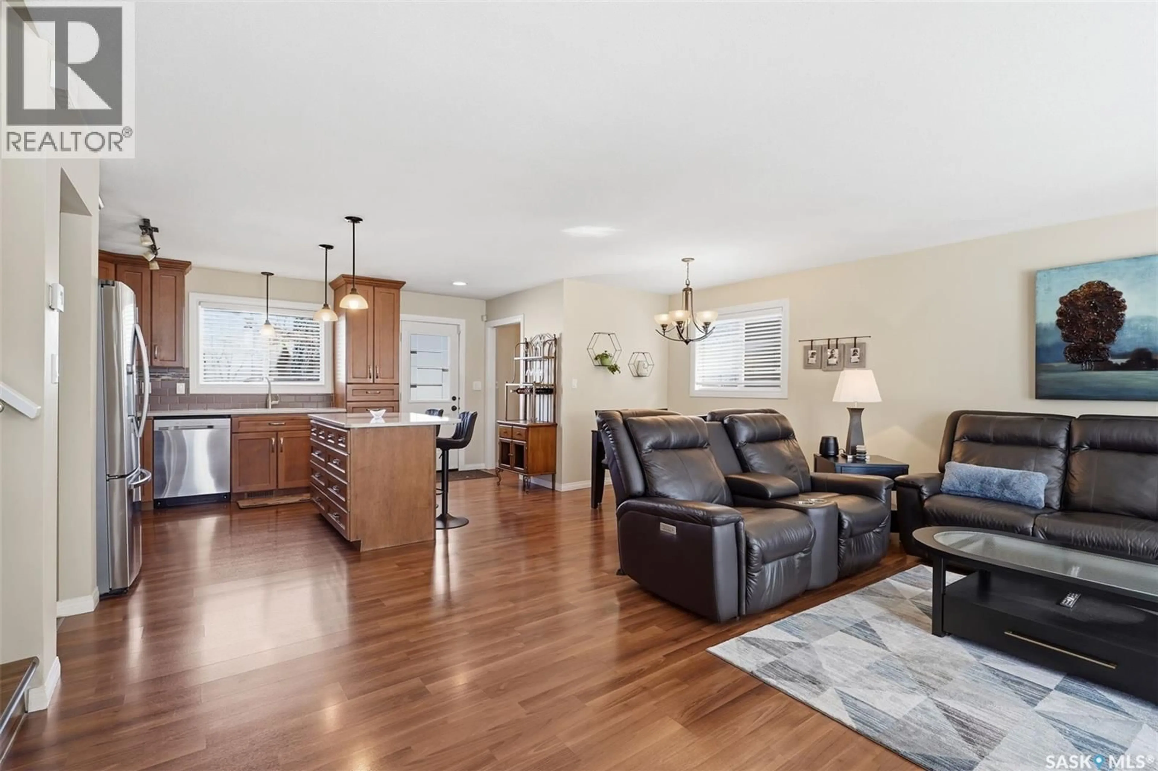 Open concept kitchen, wood/laminate floor for 138 QUILL CRESCENT, Saskatoon Saskatchewan S7K4T9