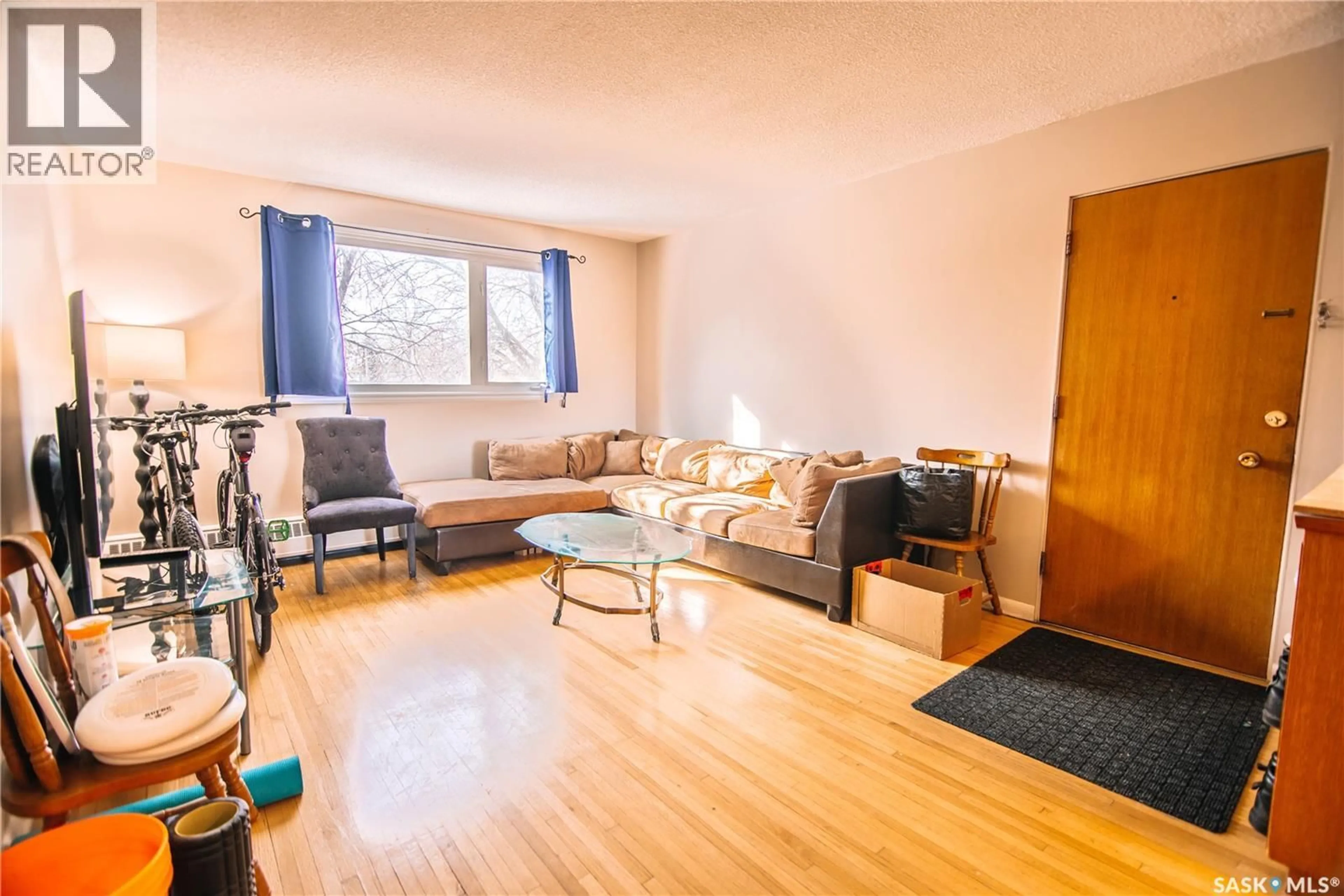 Living room with furniture, wood/laminate floor for 4 - 6 NEILL PLACE, Regina Saskatchewan S4N2V4