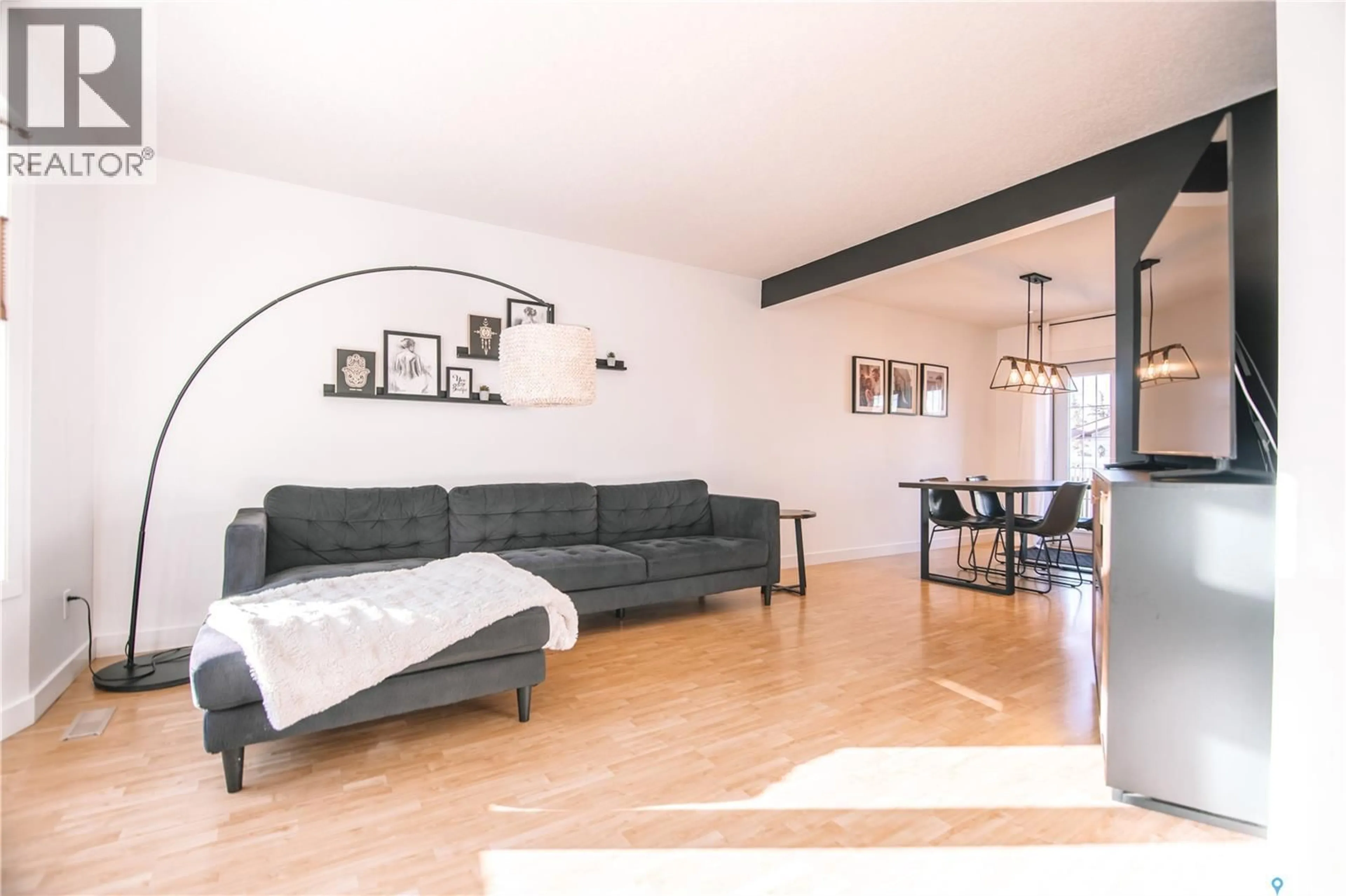 Living room with furniture, wood/laminate floor for 1222 FLEXMAN CRESCENT, Regina Saskatchewan S4X2Y8