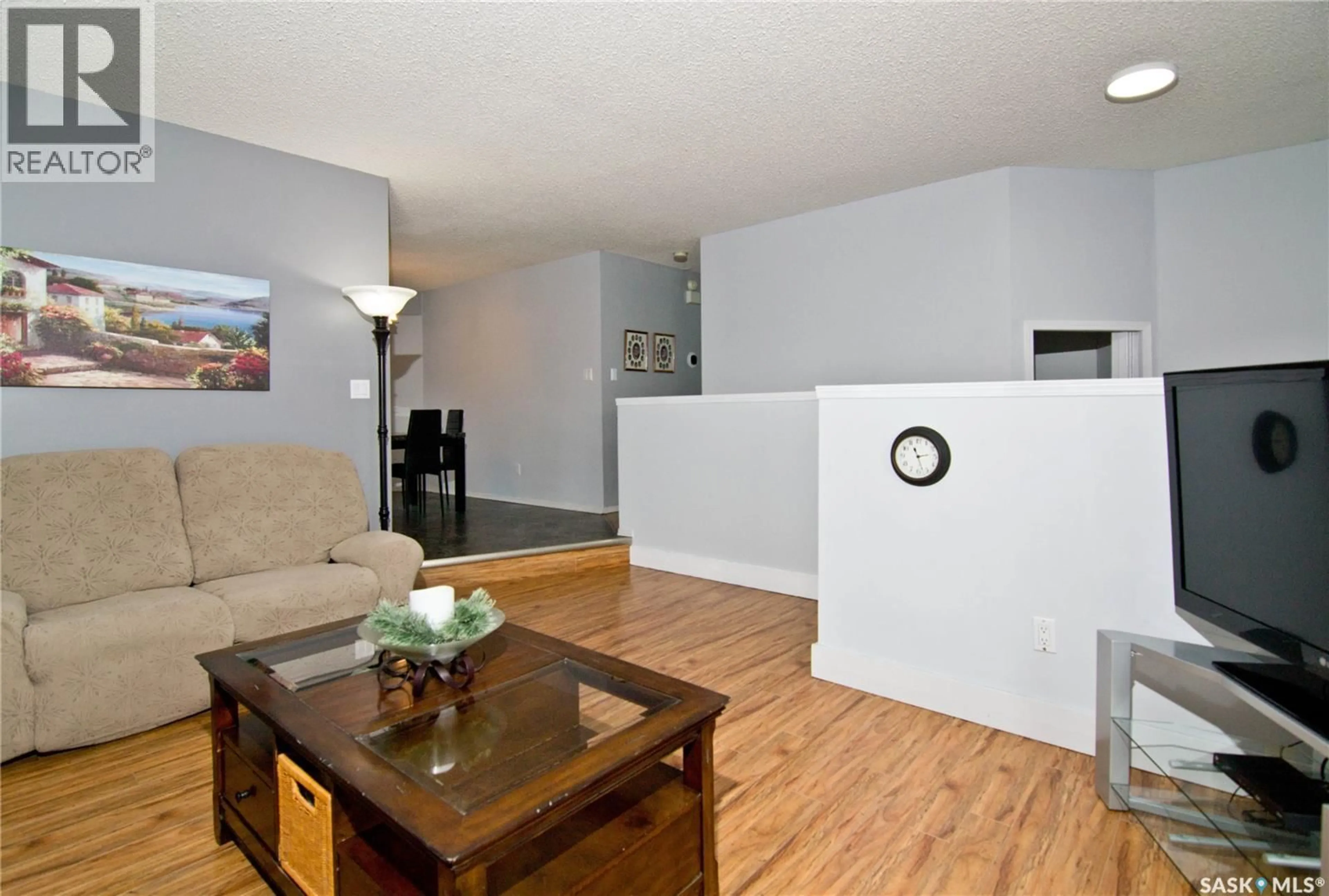 Living room with furniture, wood/laminate floor for 1026 BAYDA CRESCENT, Regina Saskatchewan S4S6Y5
