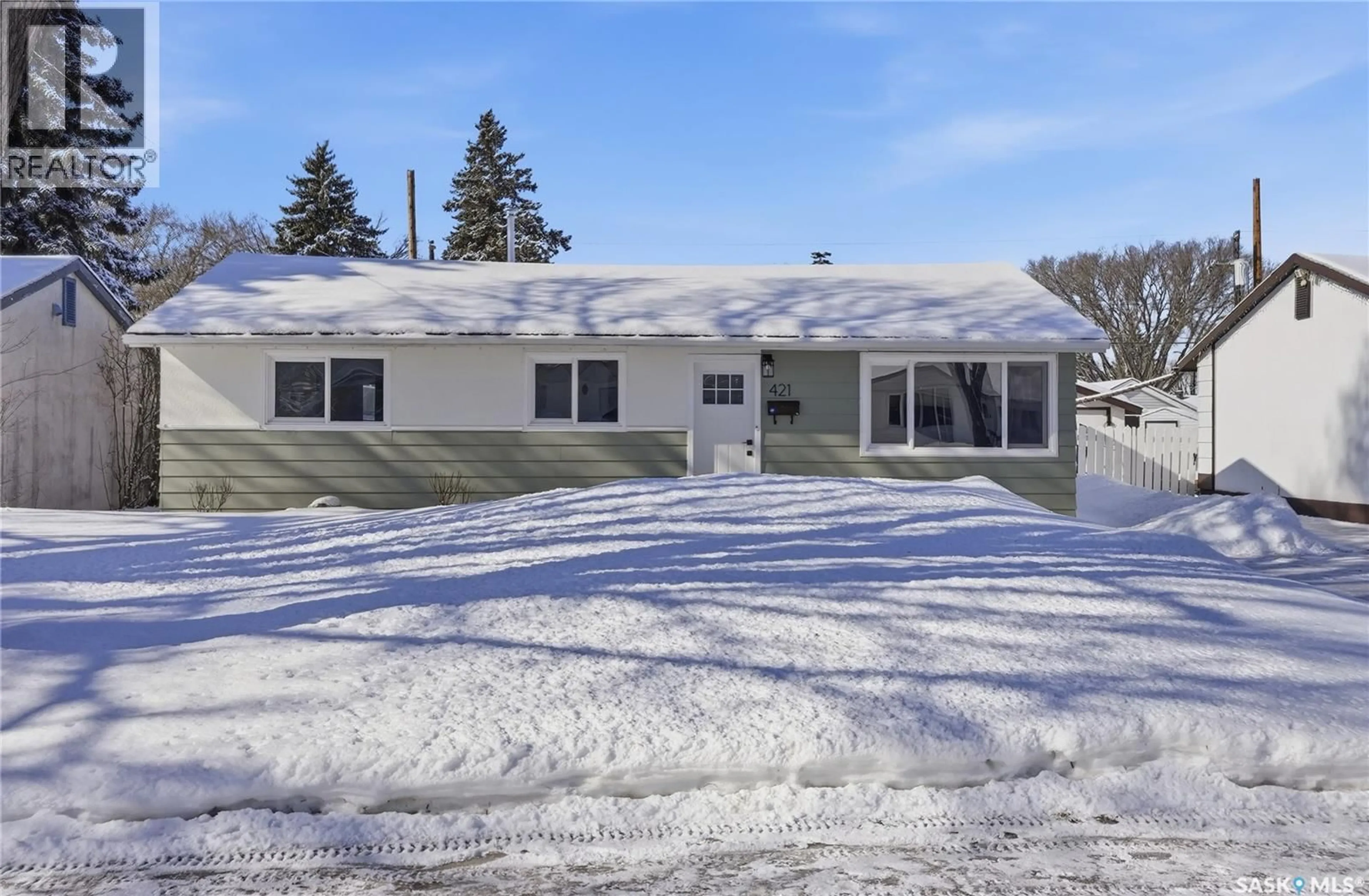 Home with vinyl exterior material, street for 421 X AVENUE, Saskatoon Saskatchewan S7L3K1