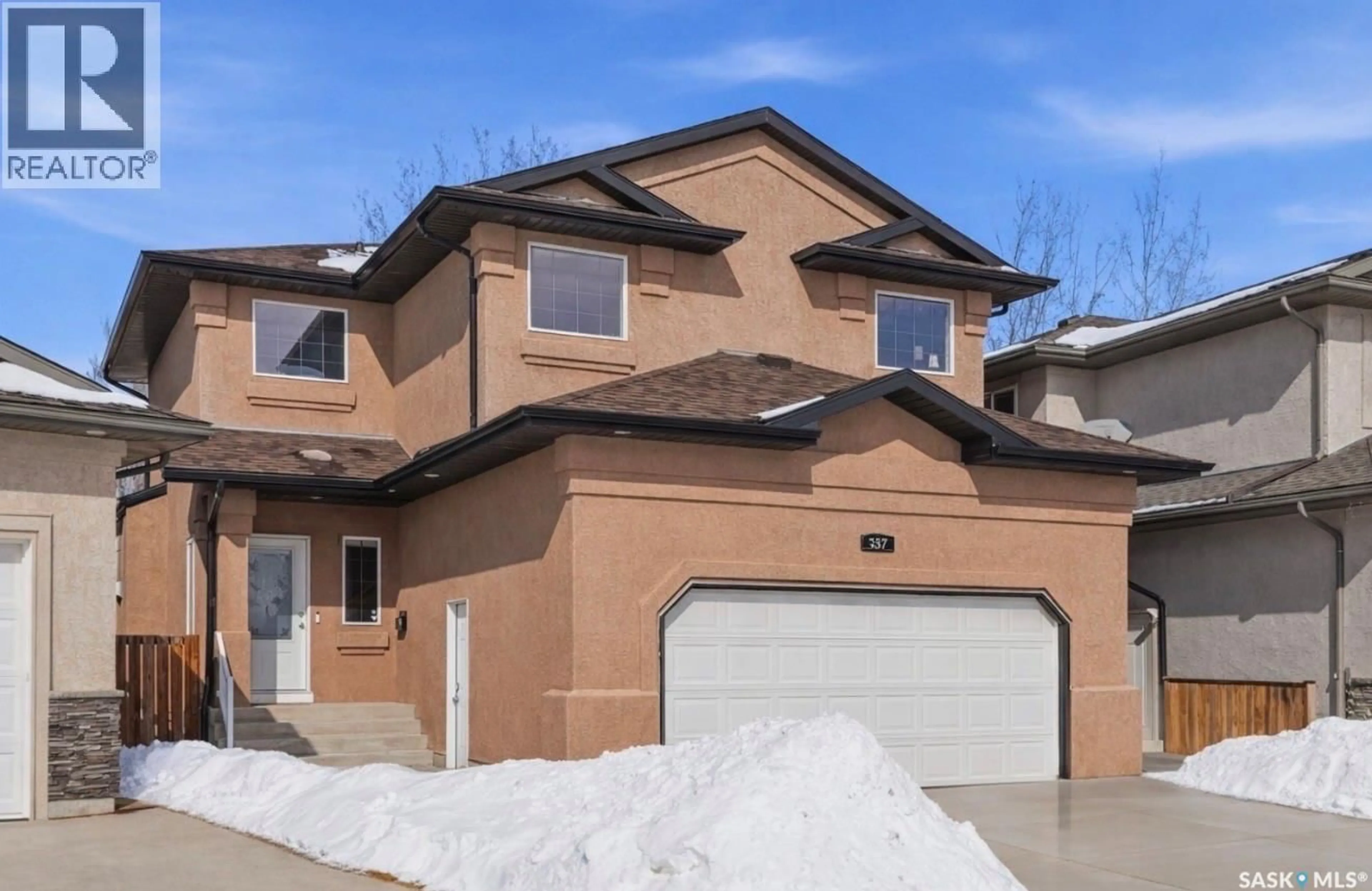 Home with brick exterior material, street for 307 BECKETT GREEN, Saskatoon Saskatchewan S7N4W7