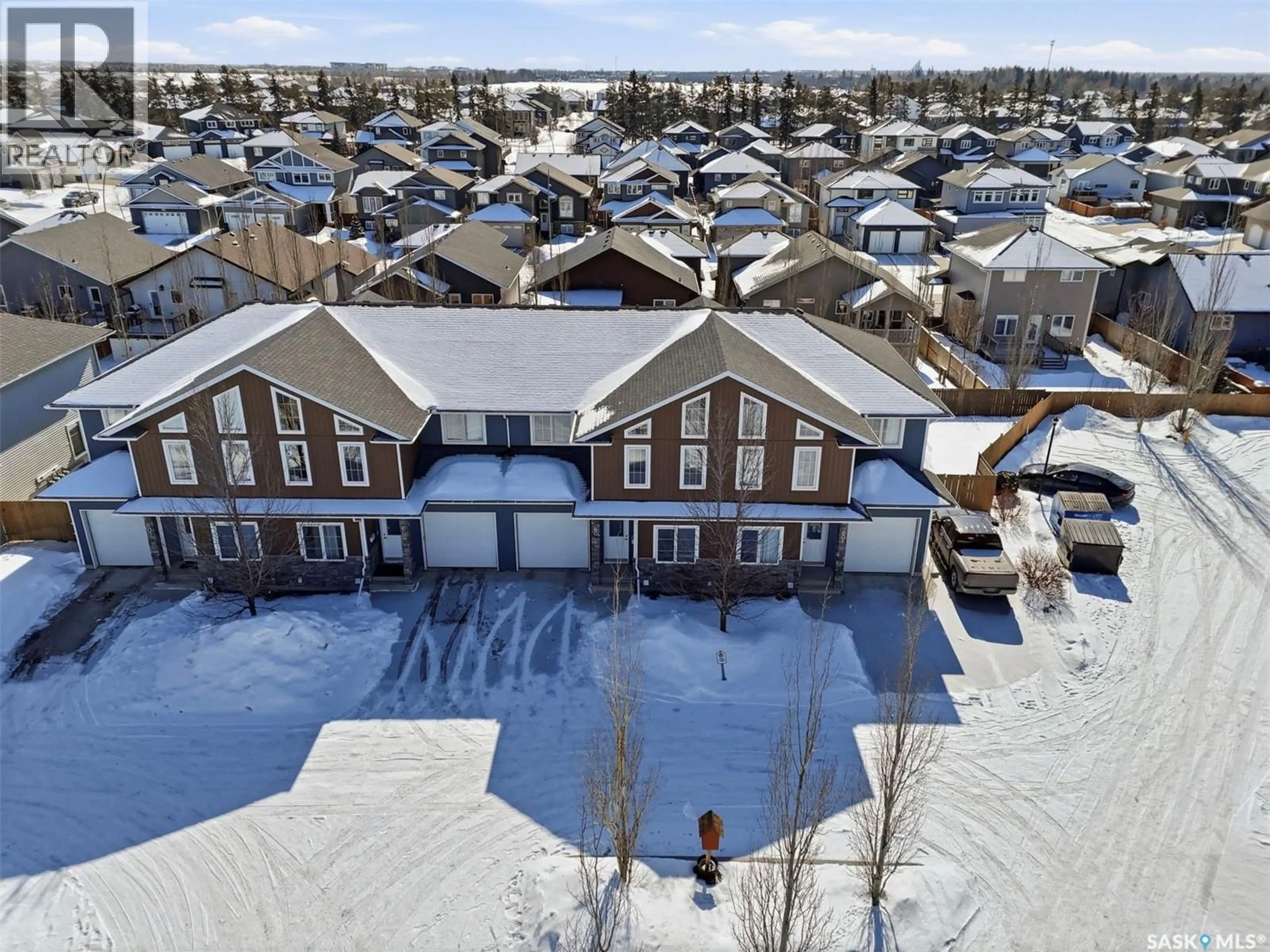 A pic from outside/outdoor area/front of a property/back of a property/a pic from drone, street for 603 315 ZARY ROAD, Saskatoon Saskatchewan S7W0N9