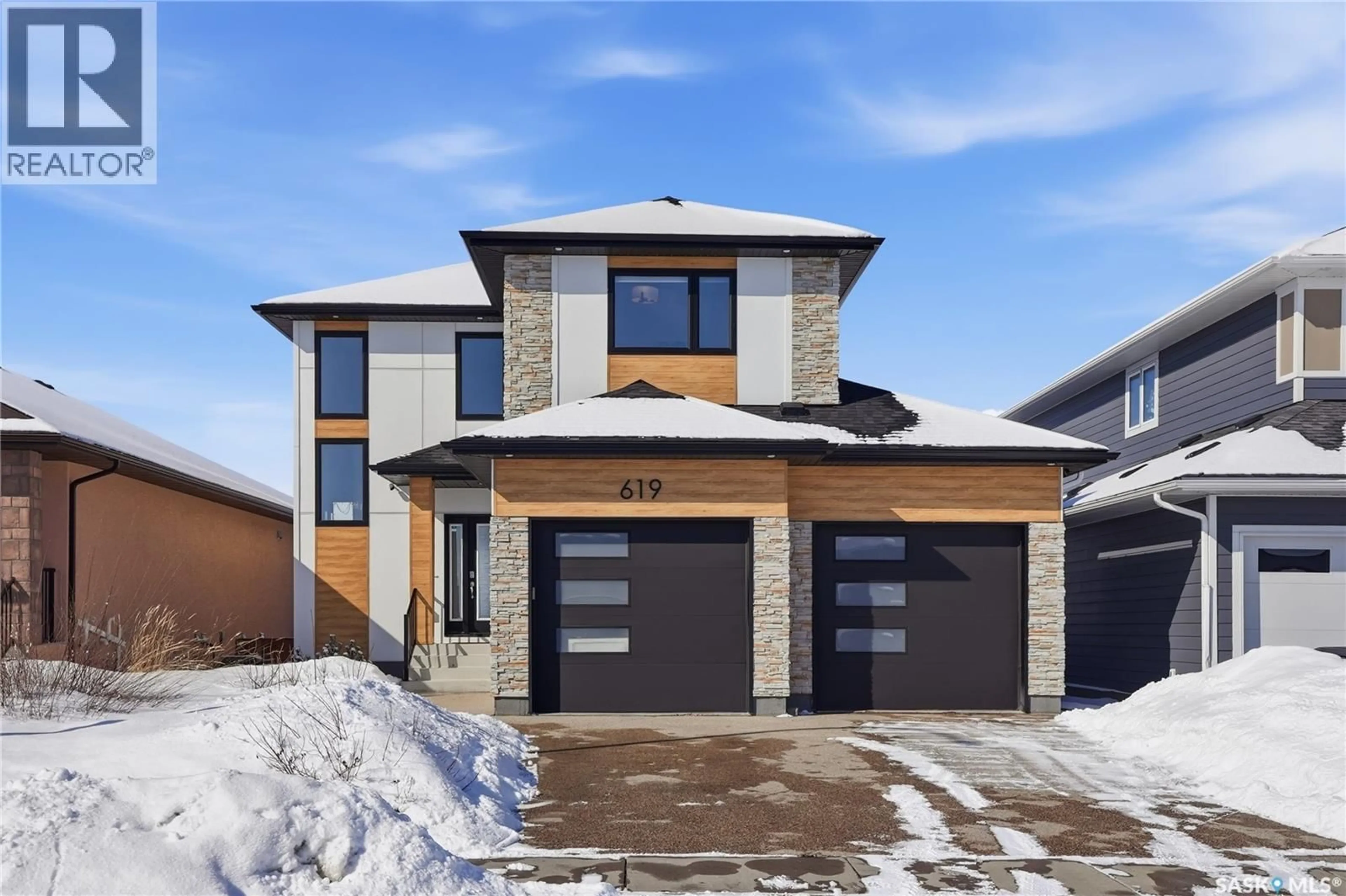 Home with brick exterior material, street for 619 FAST CRESCENT, Saskatoon Saskatchewan S7W0X1