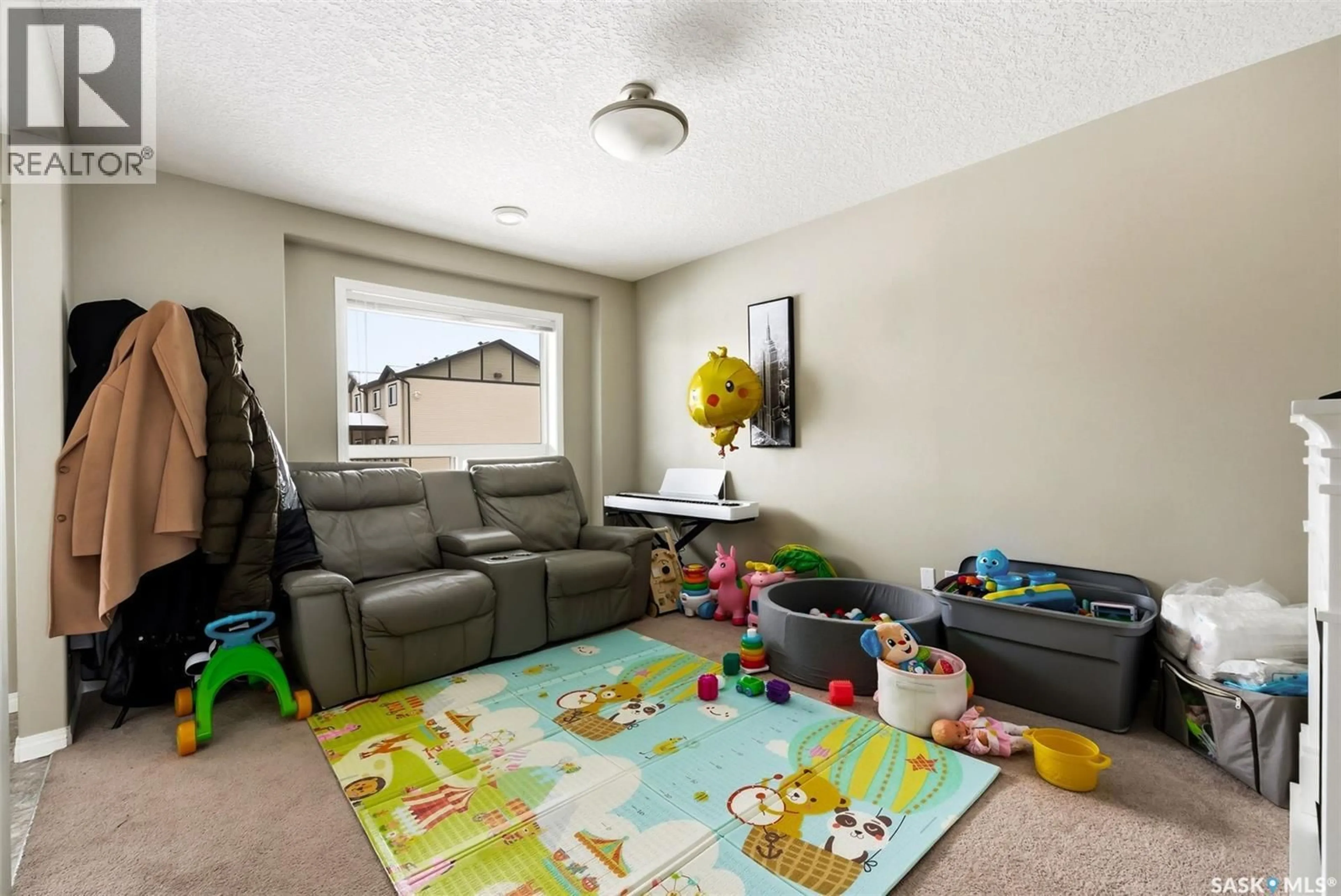 Living room with furniture, carpet floor for 308 - 3822 DEWDNEY AVENUE, Regina Saskatchewan S4Z0A6