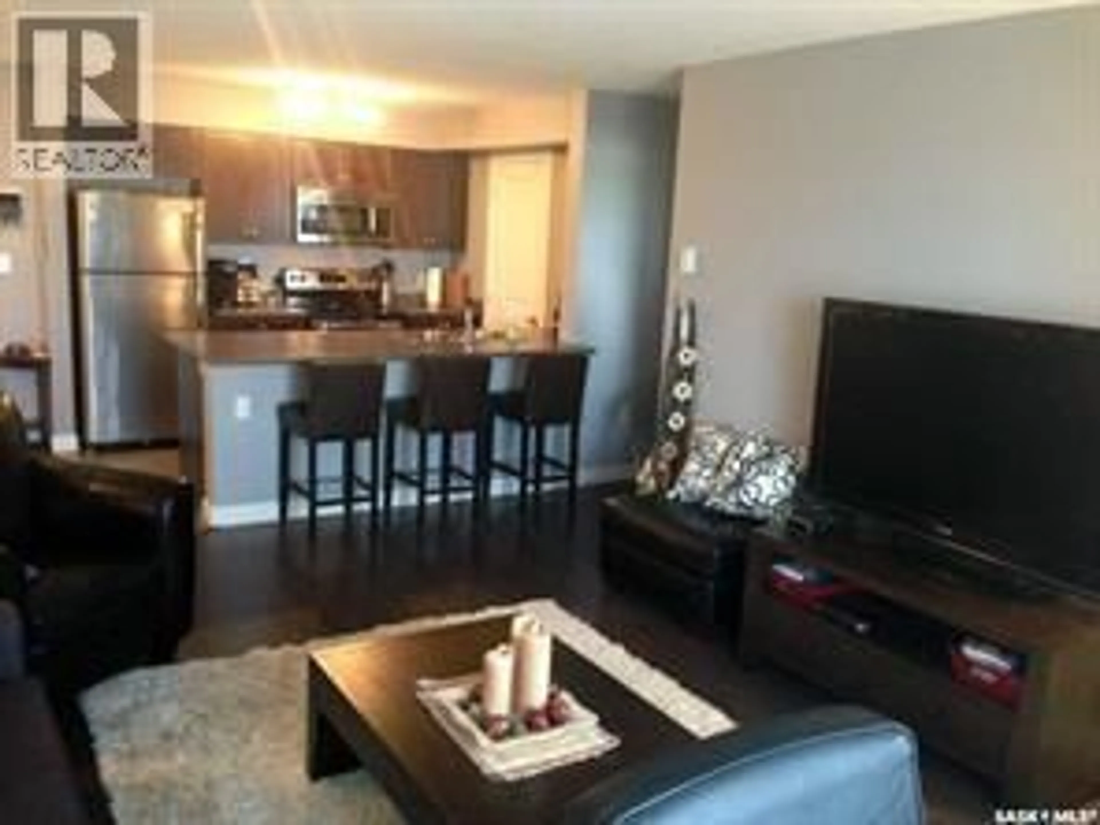Living room with furniture, wood/laminate floor for 304 - 308 PETTERSON DRIVE, Estevan Saskatchewan S4A1N7
