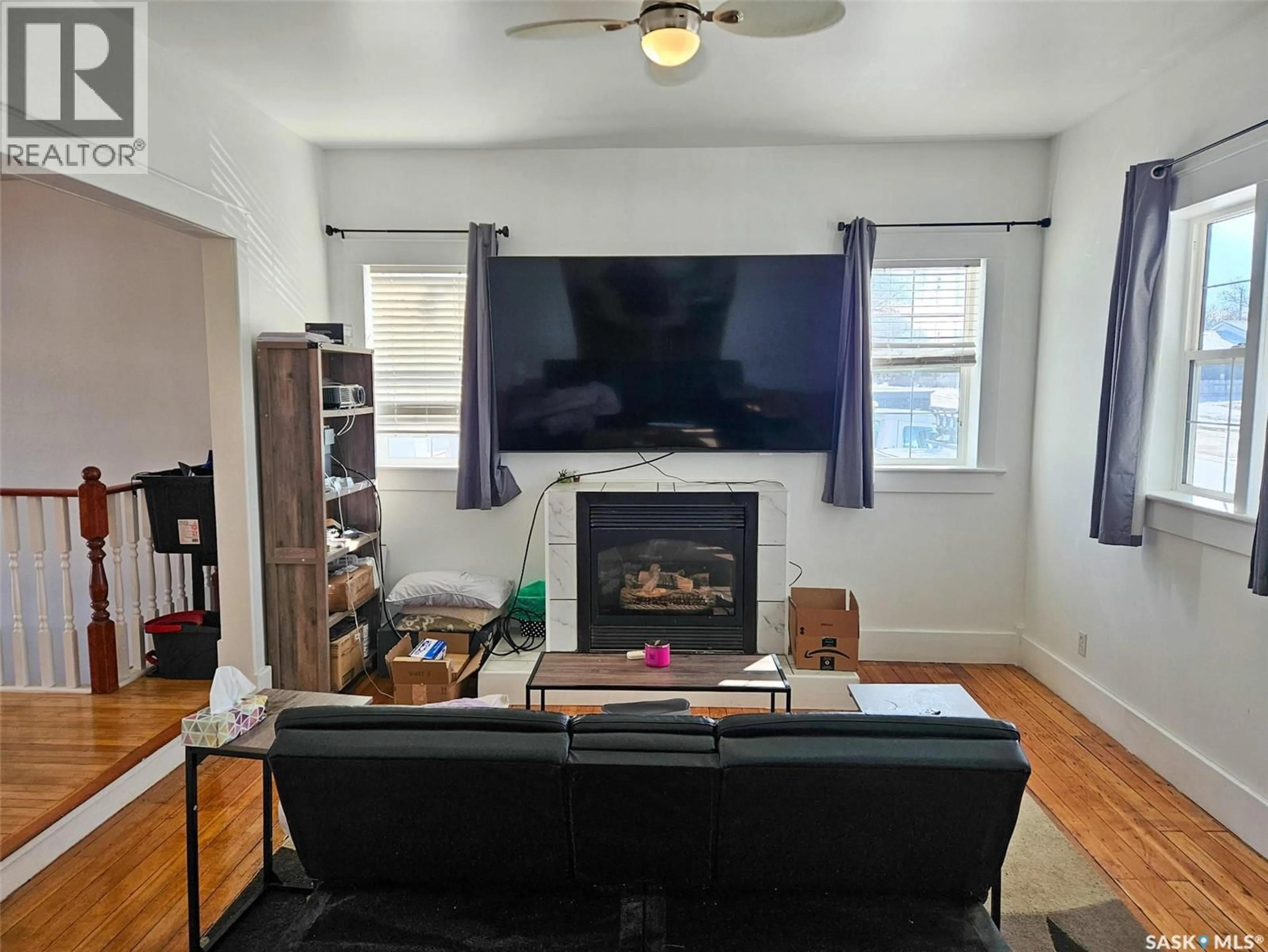 Living room with furniture, wood/laminate floor for 519 BROWNLEE STREET, Herbert Saskatchewan S0H2A0