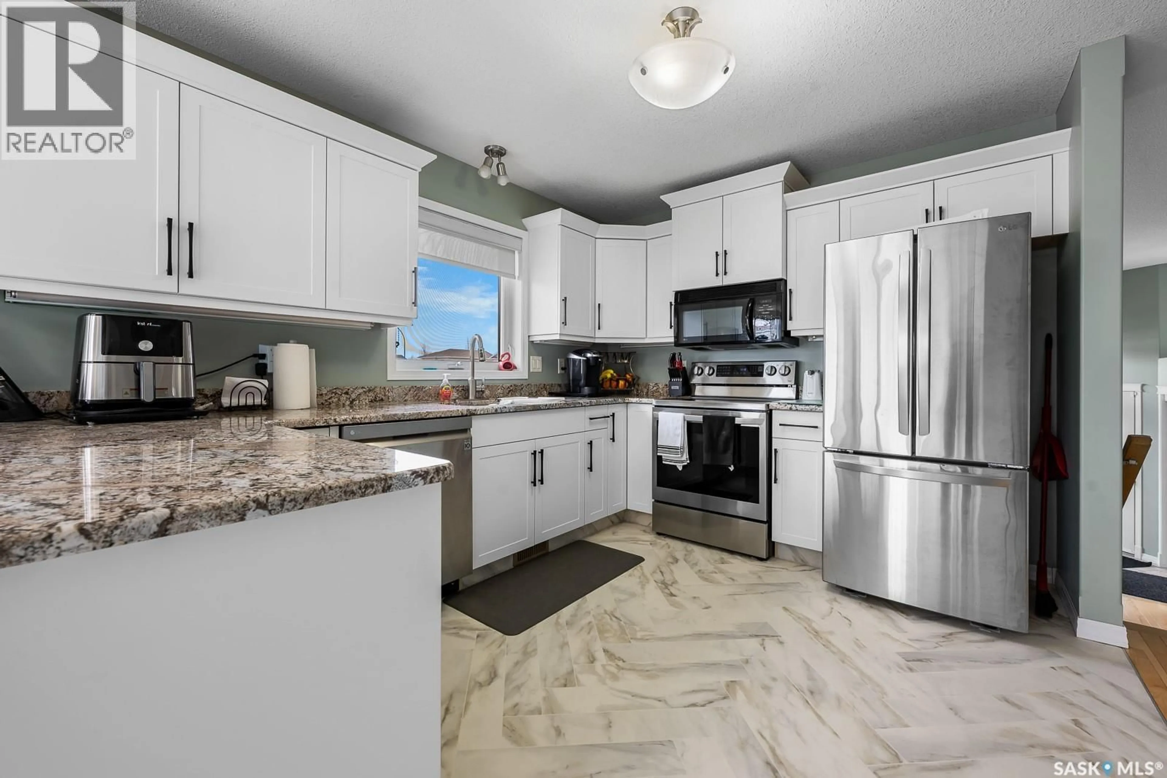 Open concept kitchen, ceramic/tile floor for 3103 ST JAMES ROAD, Regina Saskatchewan S4V3B3