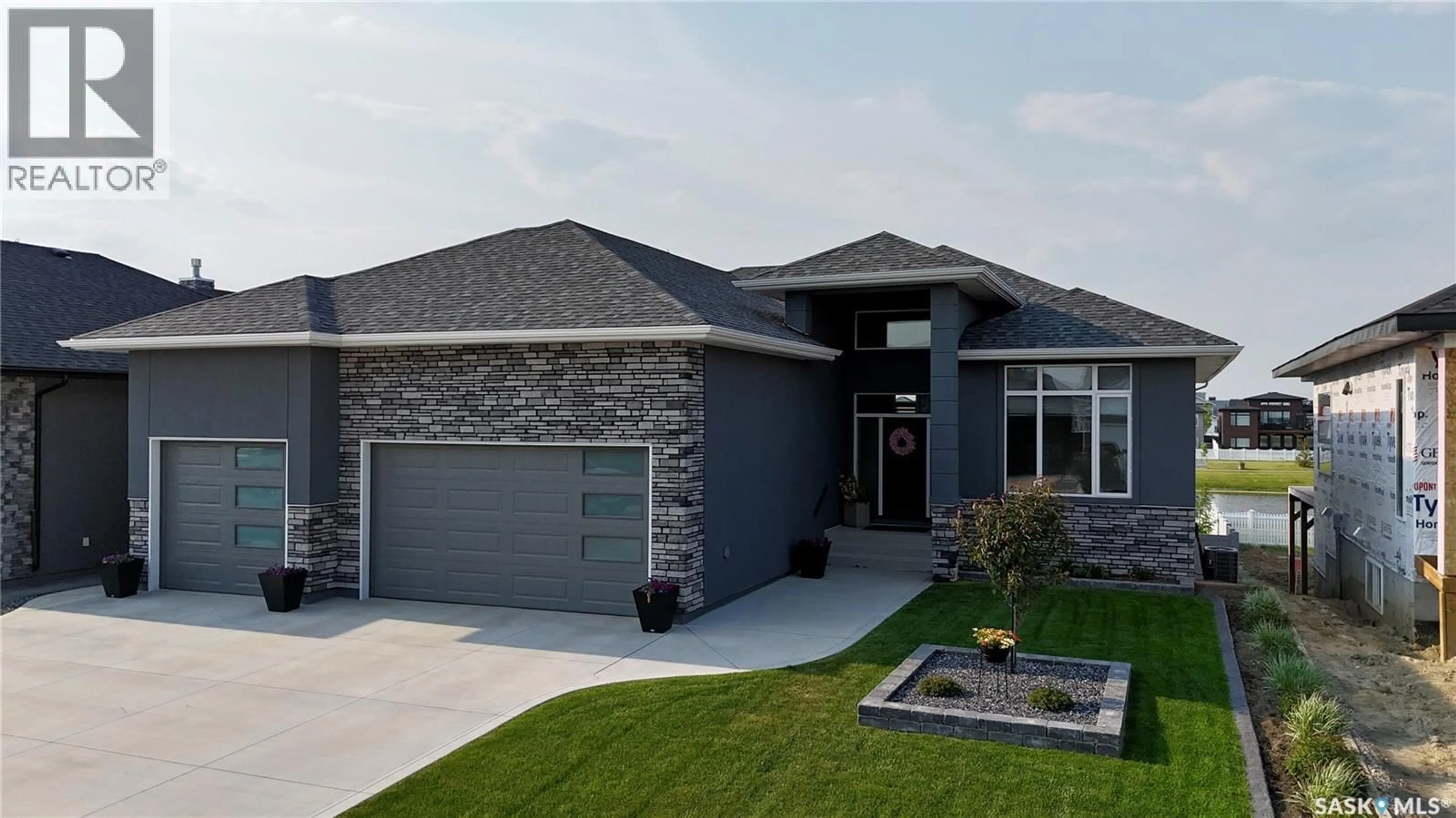 Home with brick exterior material, street for 407 PALMER CRESCENT, Warman Saskatchewan S0K4S0