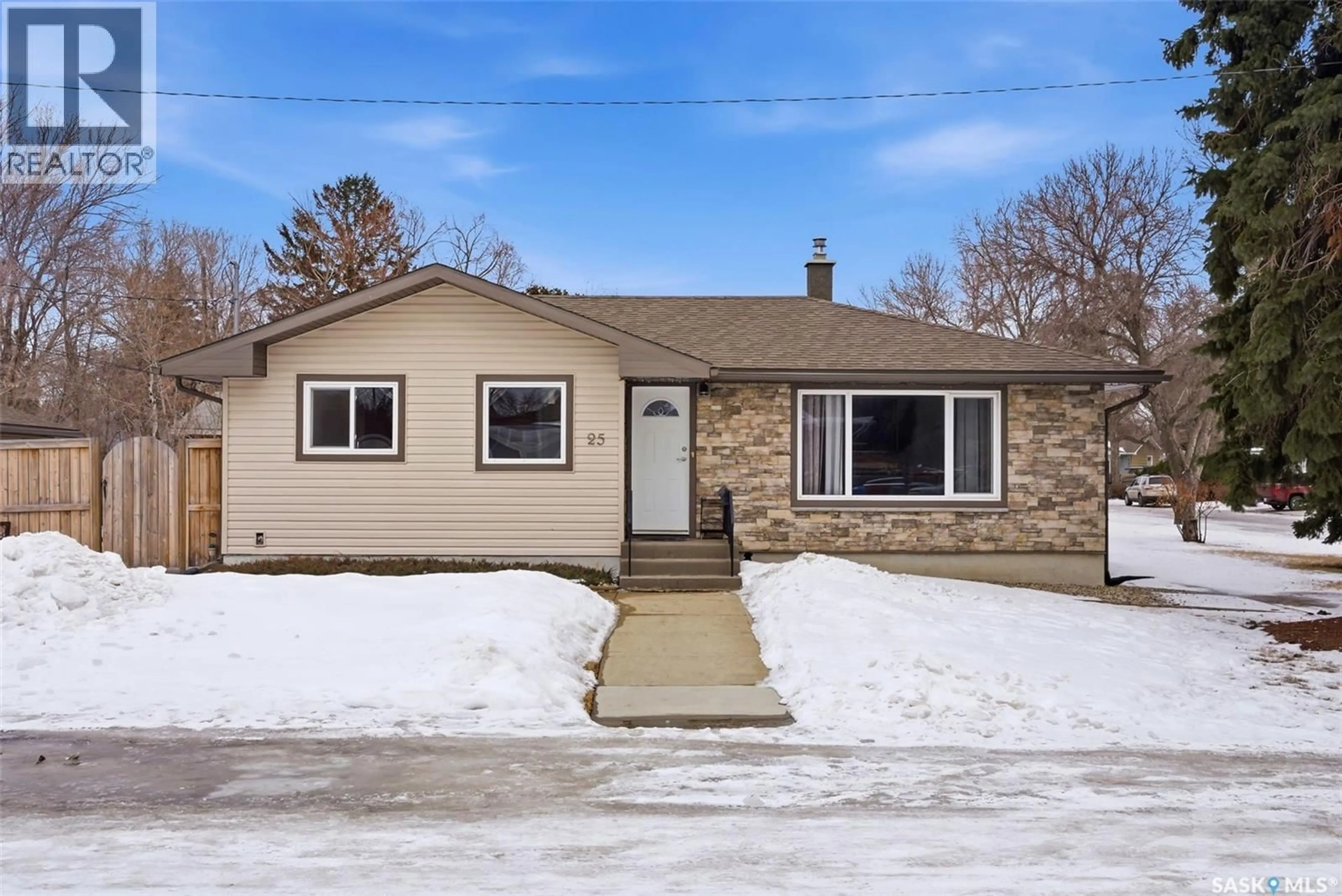 Home with vinyl exterior material, street for 25 CHINOOK ROAD, Regina Saskatchewan S4S5C3