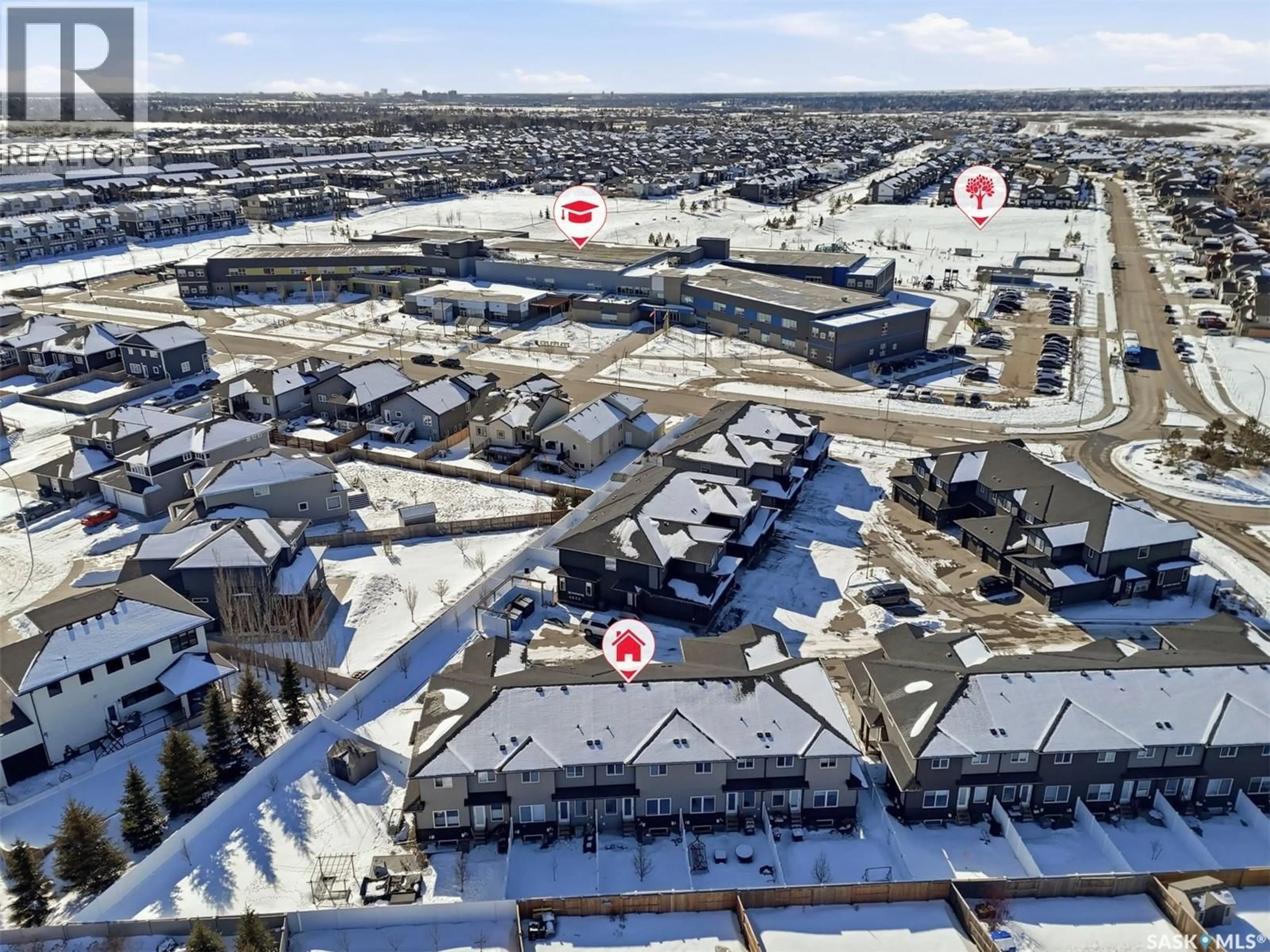 A pic from outside/outdoor area/front of a property/back of a property/a pic from drone, unknown for 16 1003 EVERGREEN BOULEVARD, Saskatoon Saskatchewan S7W0Z3