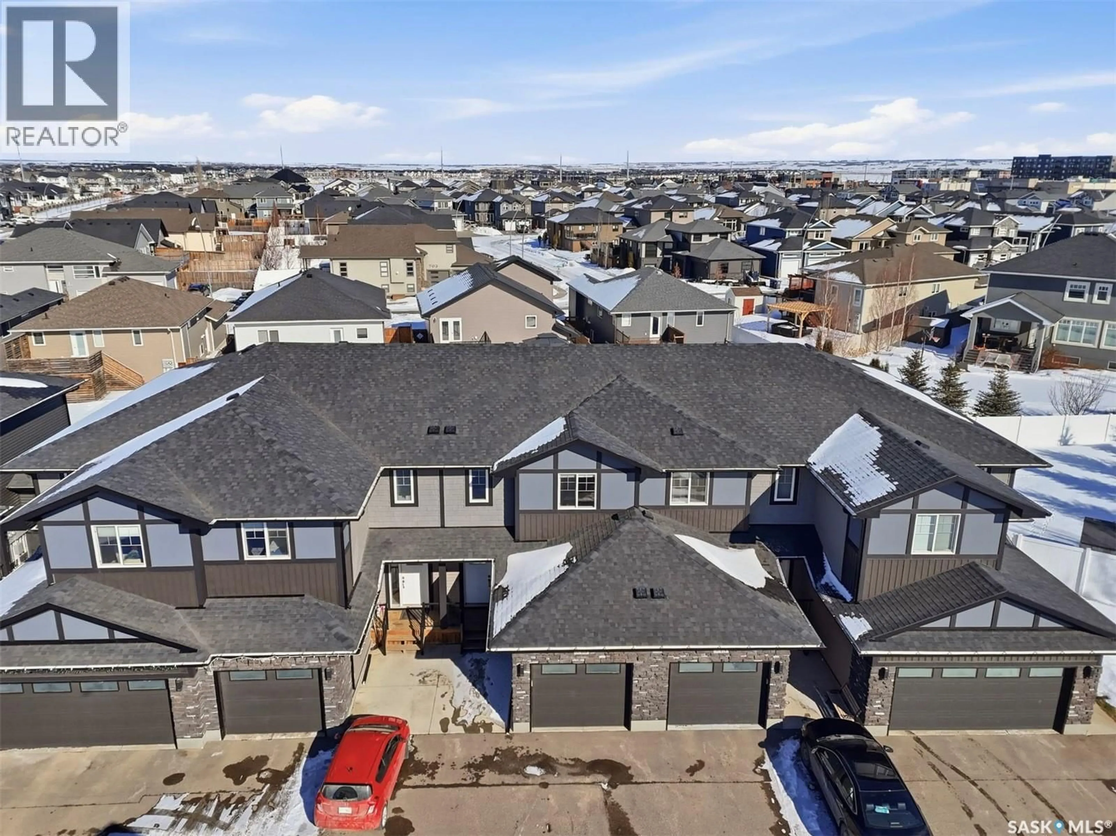 A pic from outside/outdoor area/front of a property/back of a property/a pic from drone, unknown for 16 1003 EVERGREEN BOULEVARD, Saskatoon Saskatchewan S7W0Z3