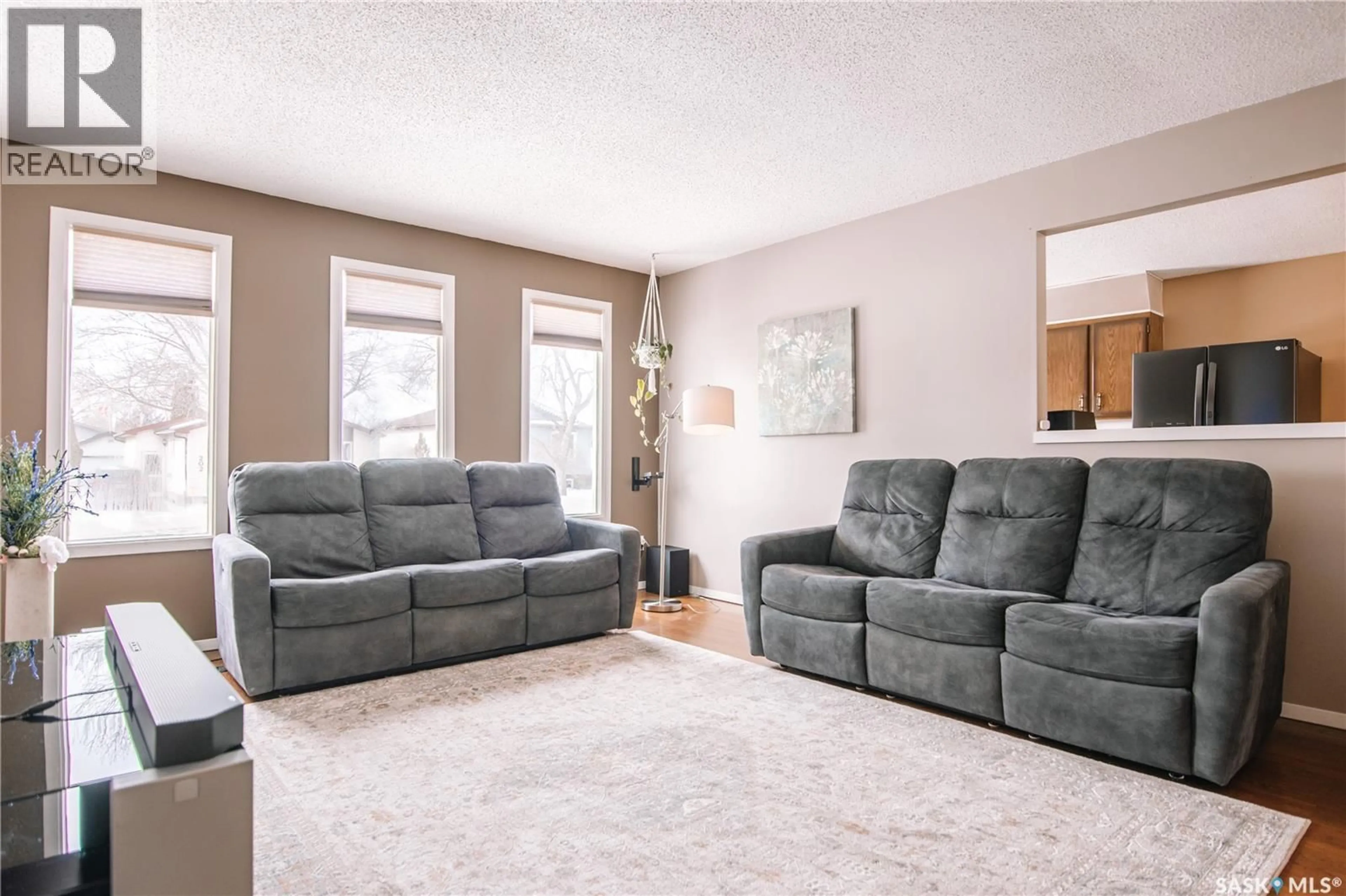 Living room with furniture, carpet floor for 203 PAYNTER CRESCENT, Regina Saskatchewan S4X2A9