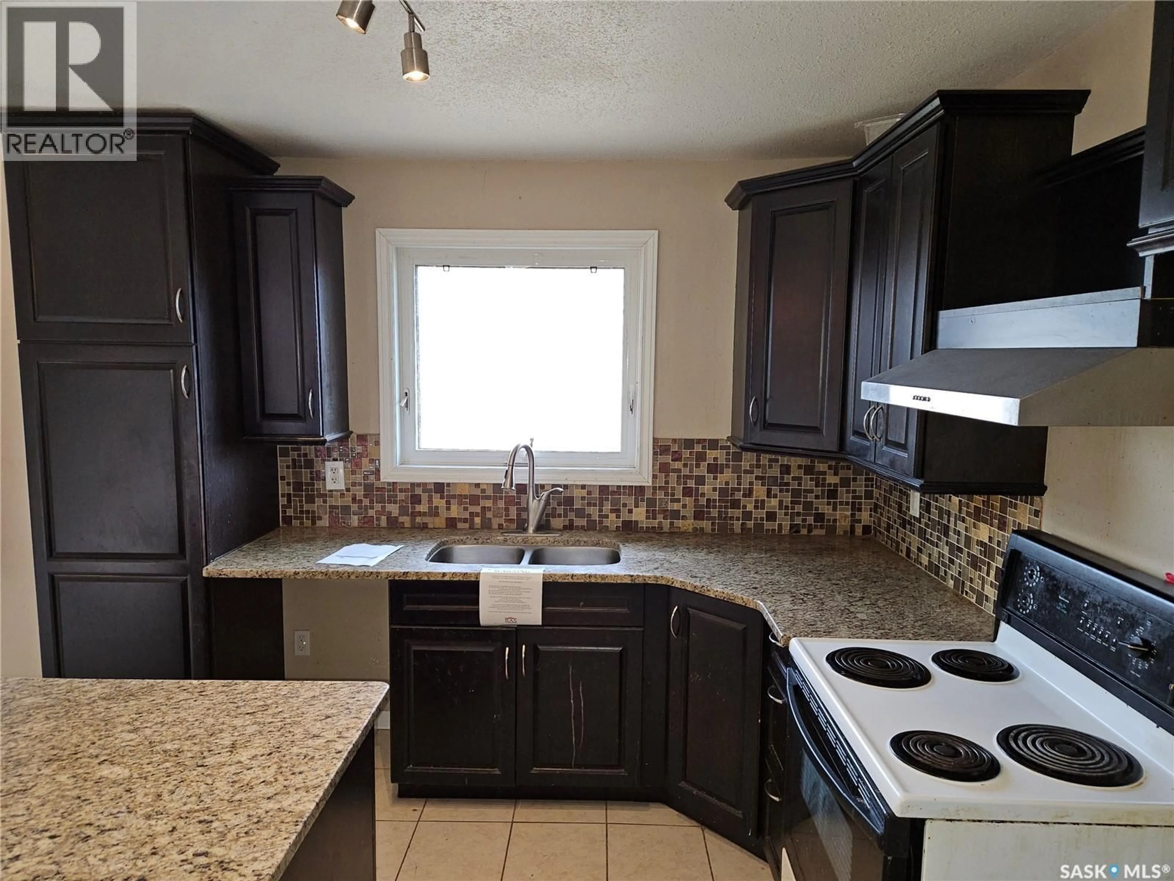 Standard kitchen, ceramic/tile floor for 235 JAMES STREET, Kisbey Saskatchewan S0C1L0