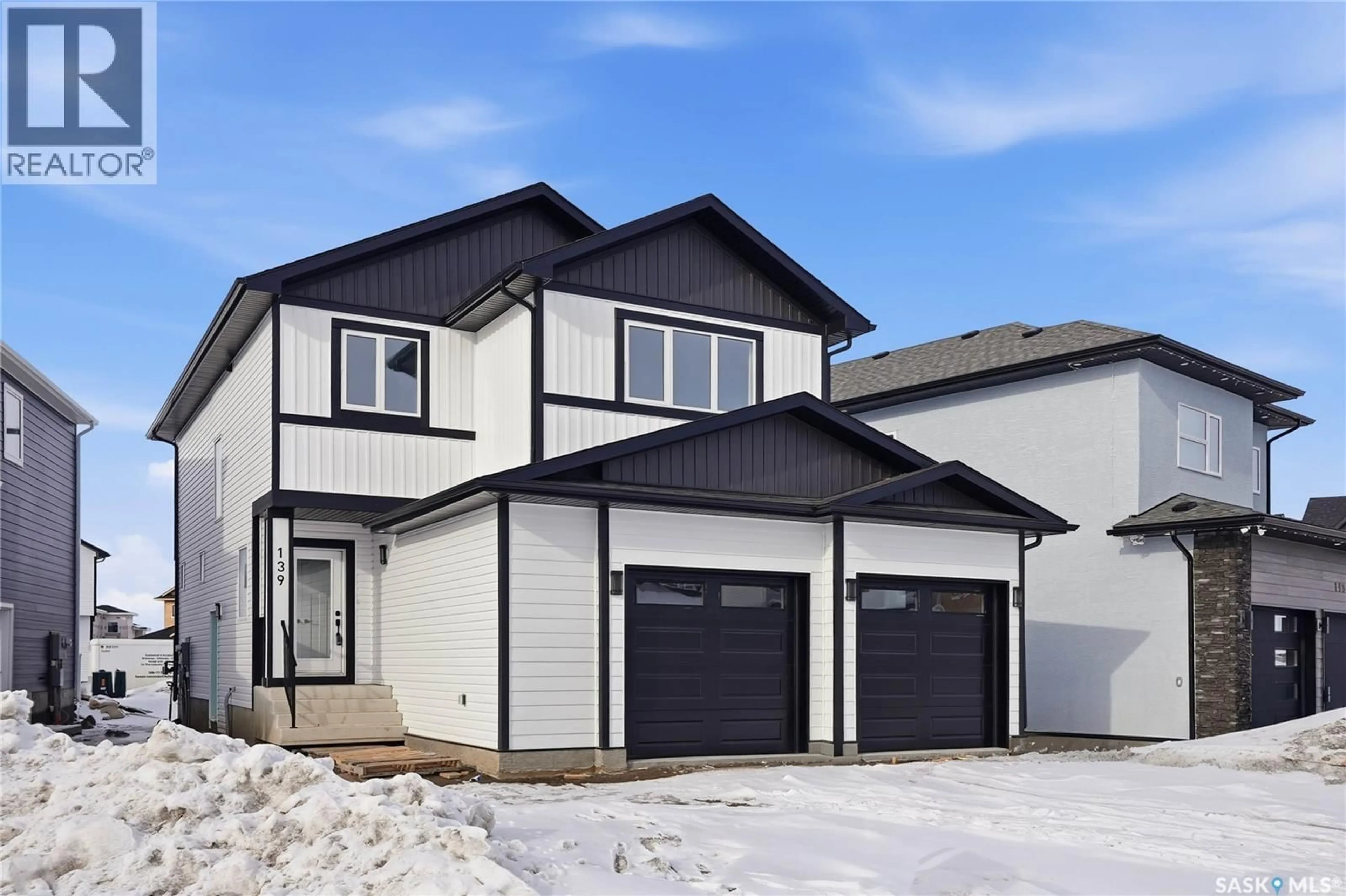 Home with vinyl exterior material, street for 139 SHARMA LANE, Saskatoon Saskatchewan S7W1L1