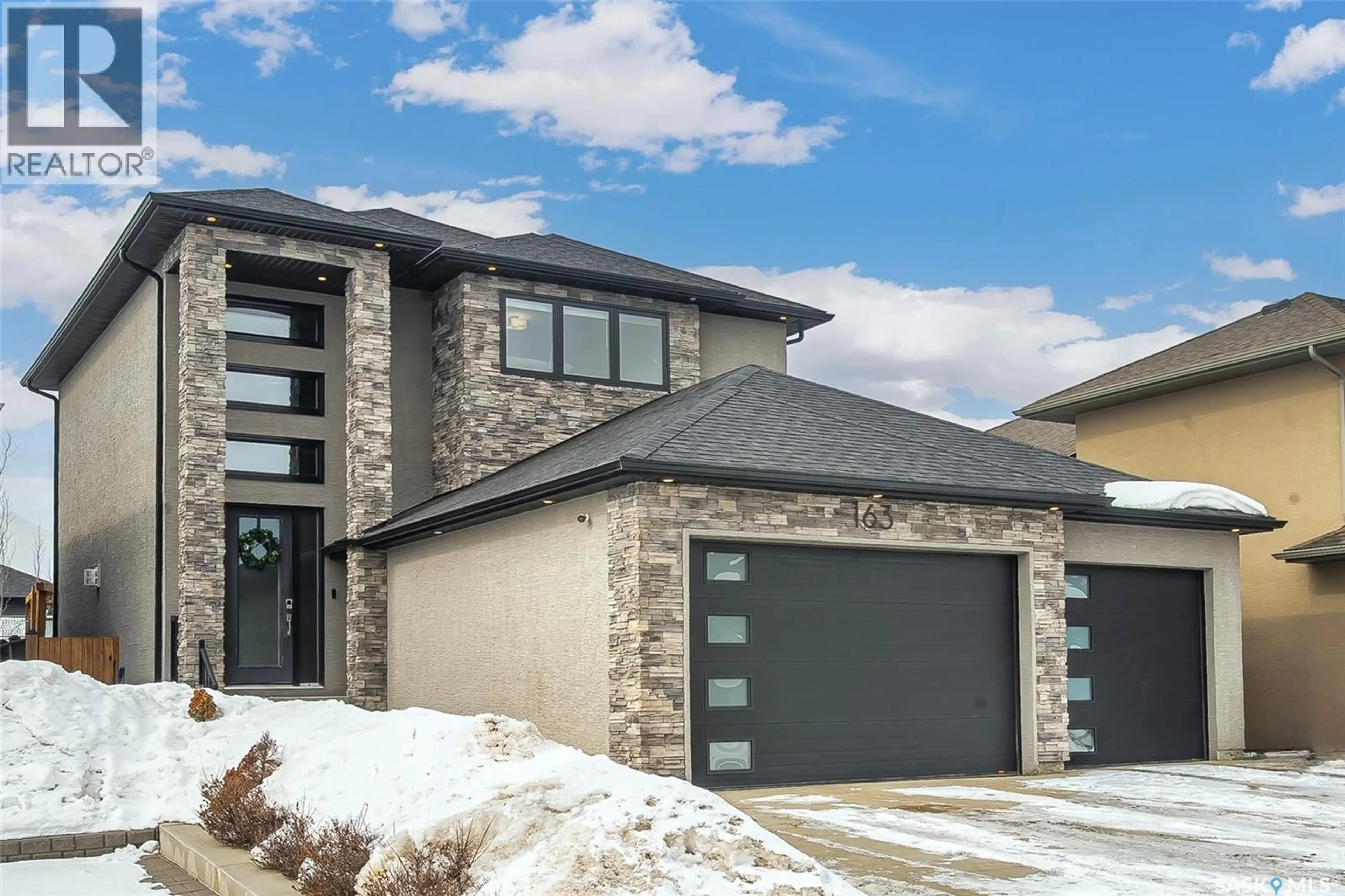 Home with brick exterior material, street for 163 SCHUMACHER BAY, Saskatoon Saskatchewan S7V0H7