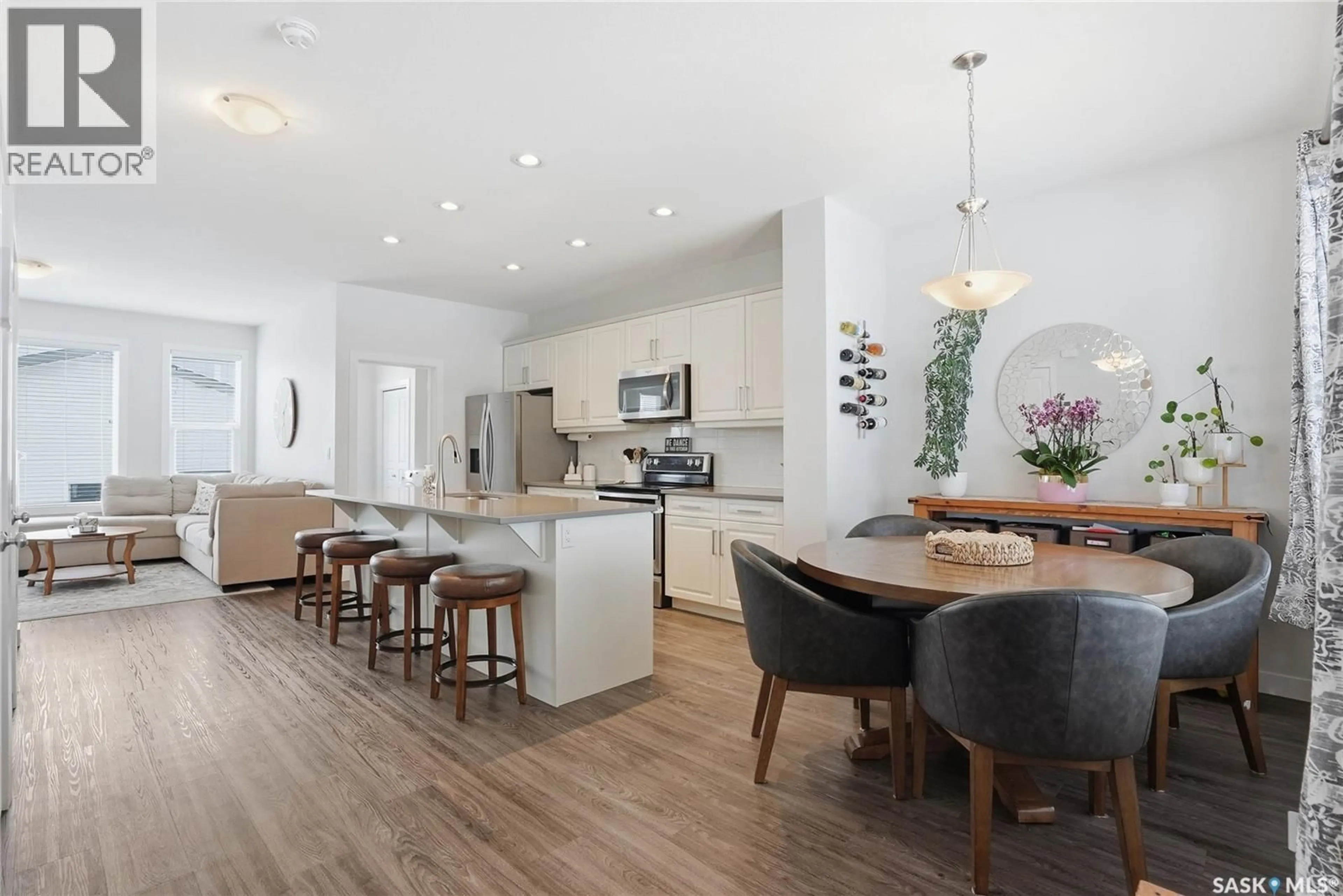 Open concept kitchen, wood/laminate floor for 675 SECORD BEND, Saskatoon Saskatchewan S7V0M3