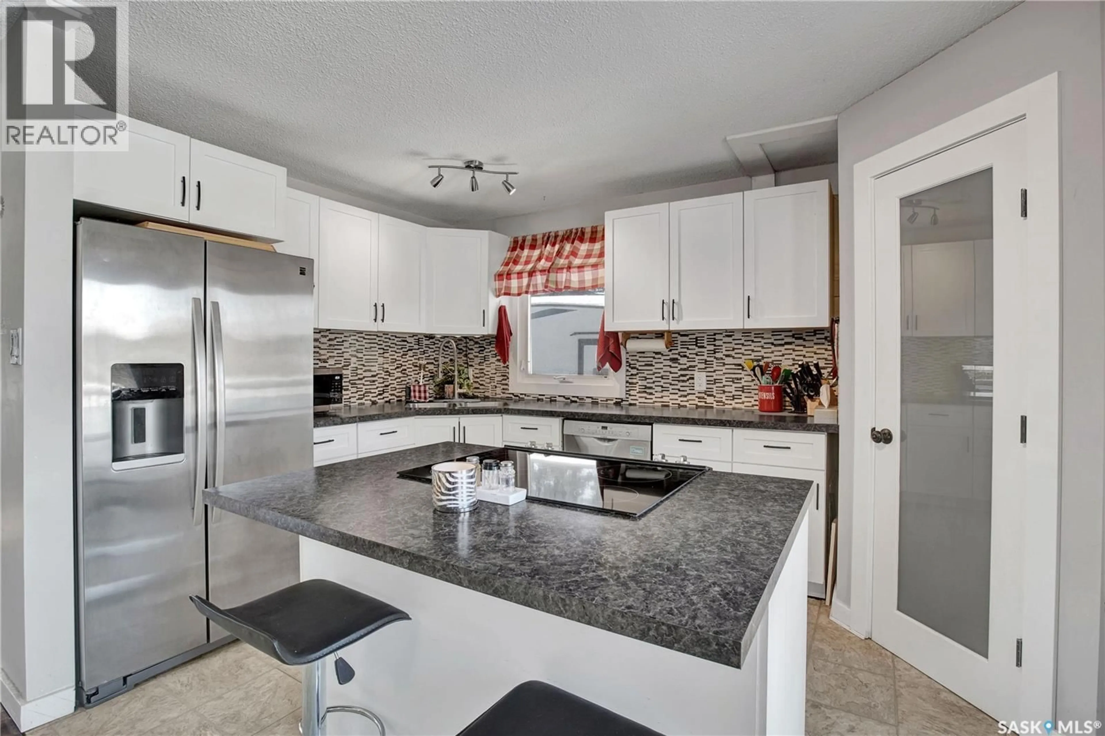 Open concept kitchen, ceramic/tile floor for 212 1ST STREET, Laird Saskatchewan S0K2H0