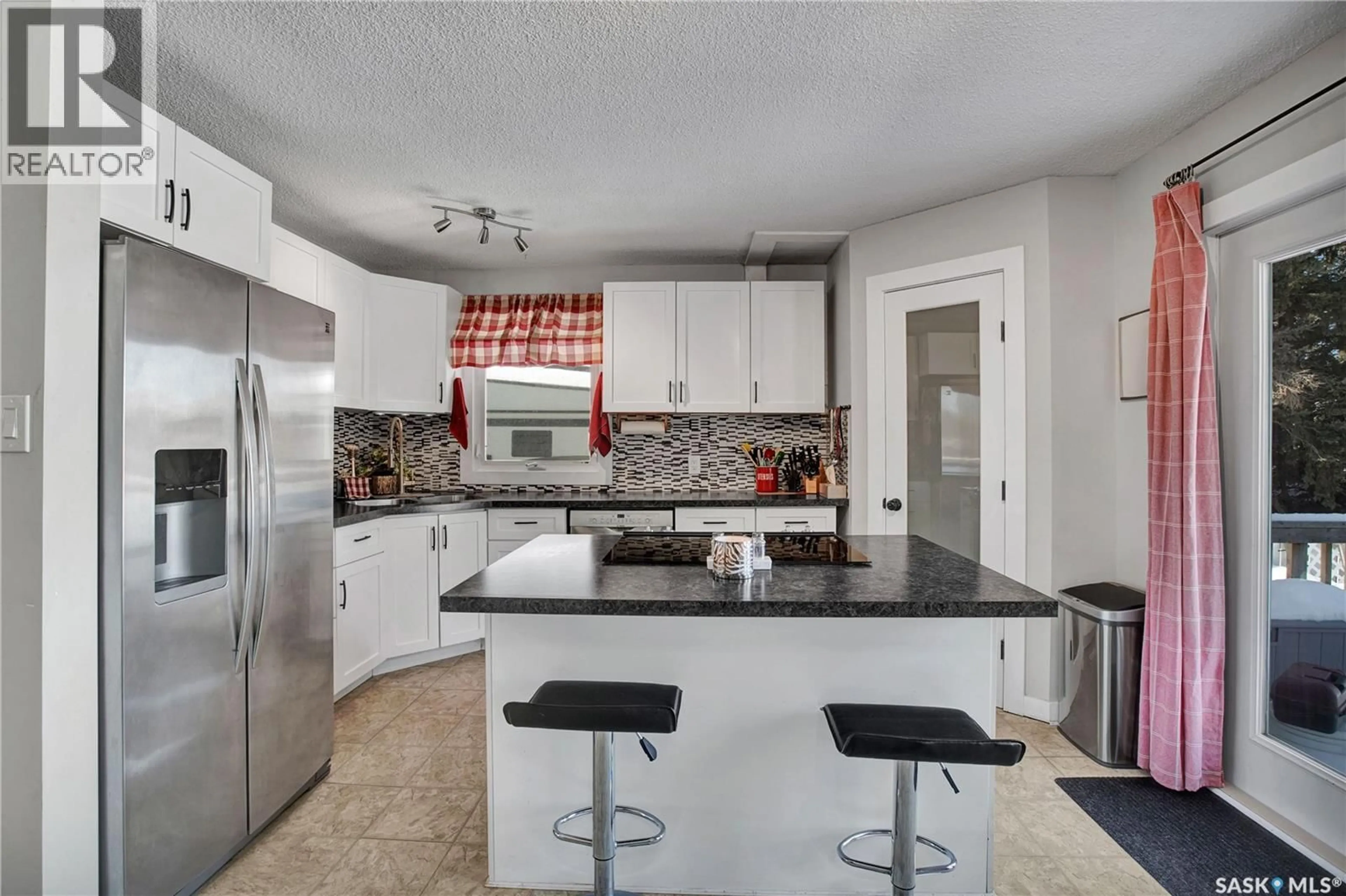 Open concept kitchen, ceramic/tile floor for 212 1ST STREET, Laird Saskatchewan S0K2H0